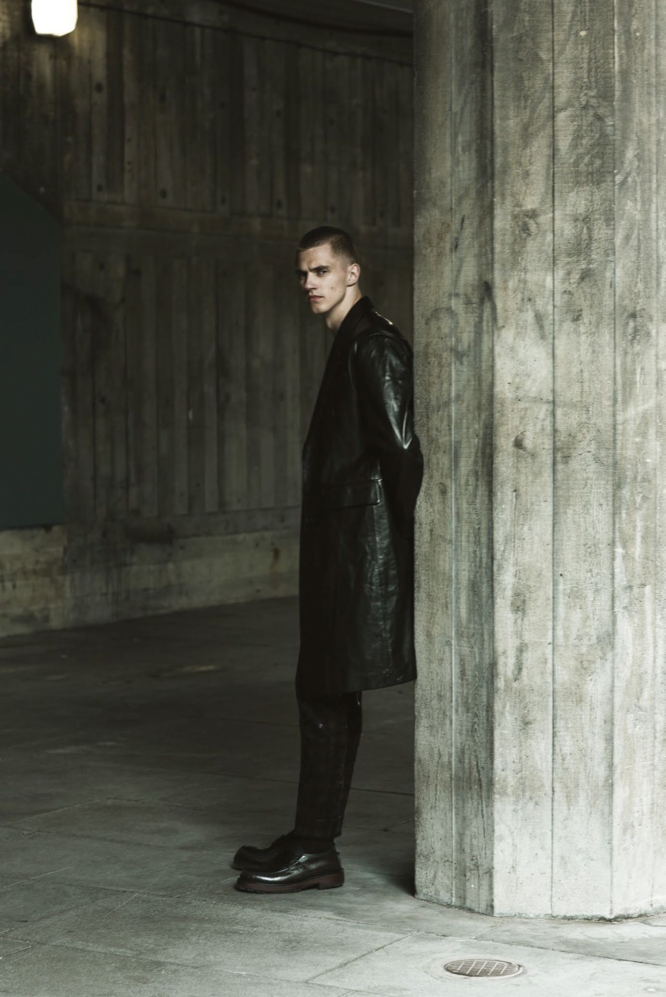Coat by Versace, jacket, trousers, and shoes by Ermenegildo Zegna