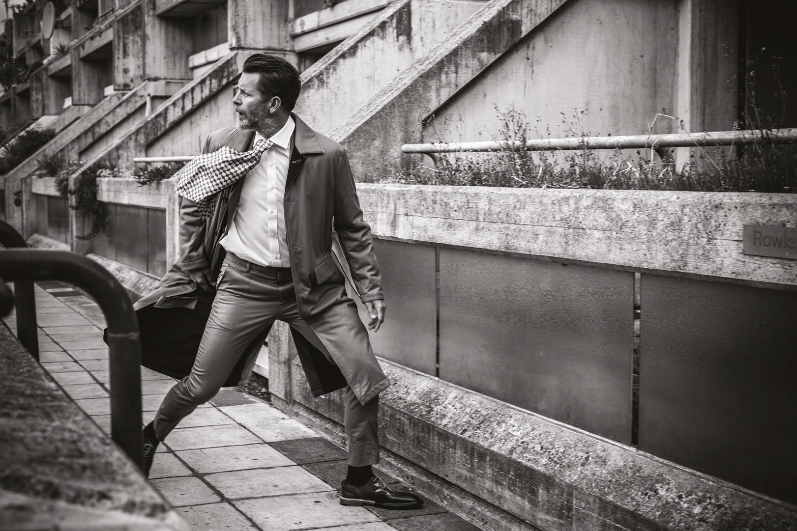 Jacket, trousers, and coat by Kenzo, tie by Gucci, shirt by Emma Willis, available at Mr Porter, shoes by Burberry