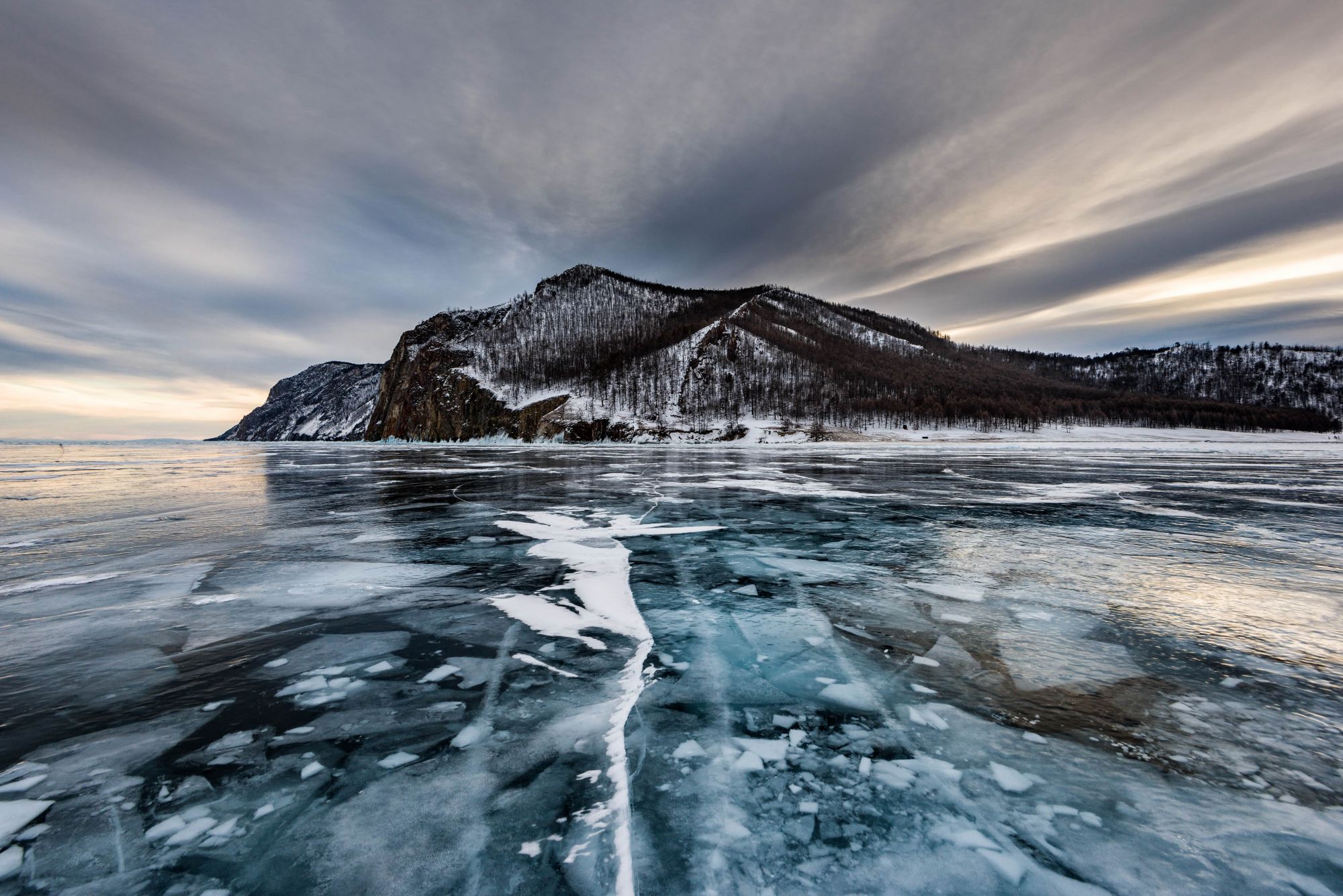 SIBERIA | Those brave enough to plunge icy depths plant trees under frozen lakes for the coming of Father Frost.