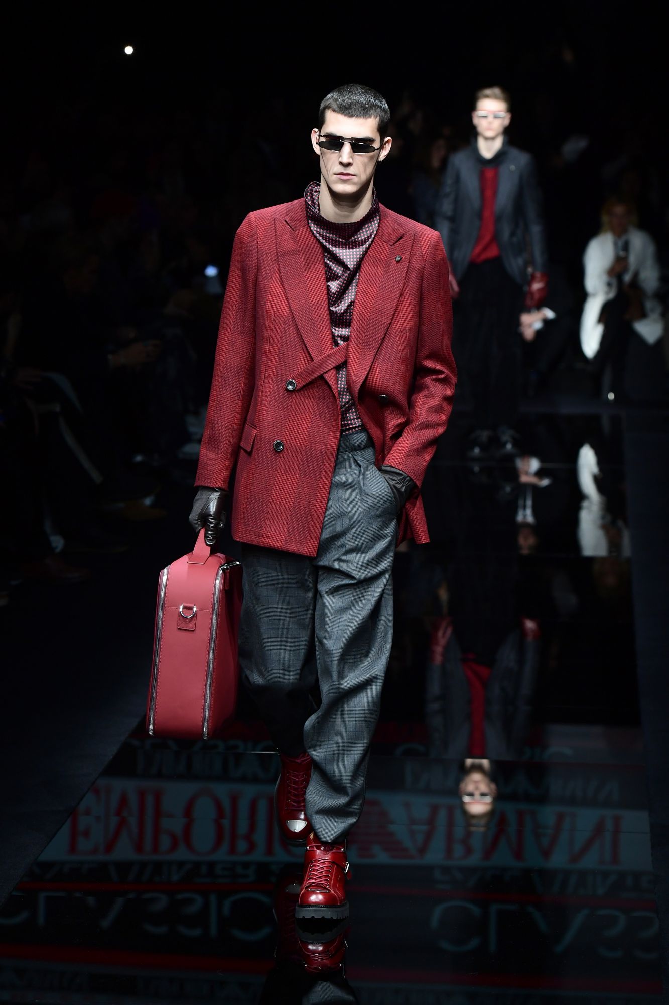 A model presents a creation for Emporio Armani as part of the men's fall/winter 2020/21 fashion collections in Milan on January 11, 2020. (Photo by Miguel MEDINA / AFP)