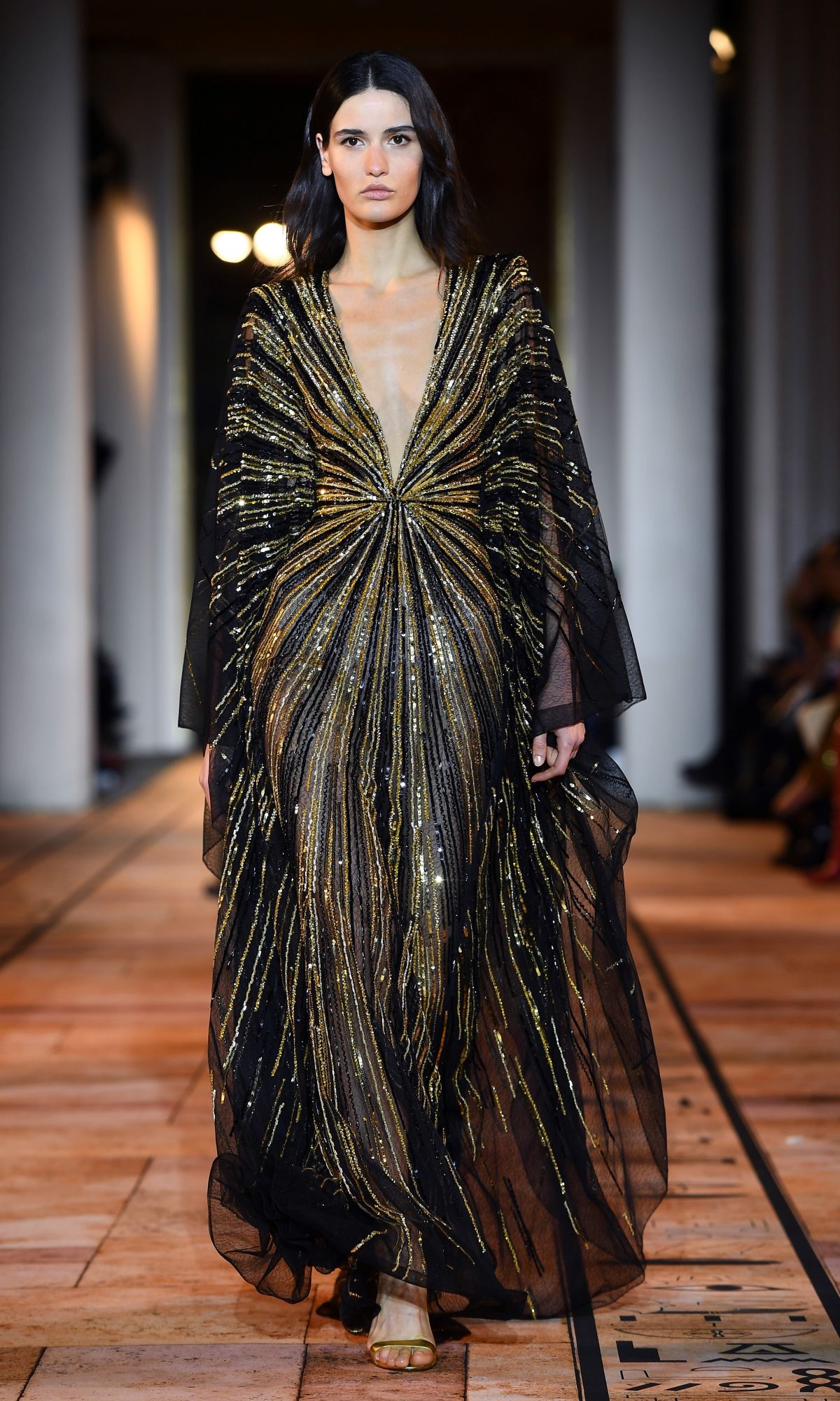 A model presents a creation by Zuhair Murad during the Women's Spring-Summer 2020 Haute Couture collection fashion show in Paris, on January 22, 2020. (Photo by CHRISTOPHE ARCHAMBAULT / AFP)