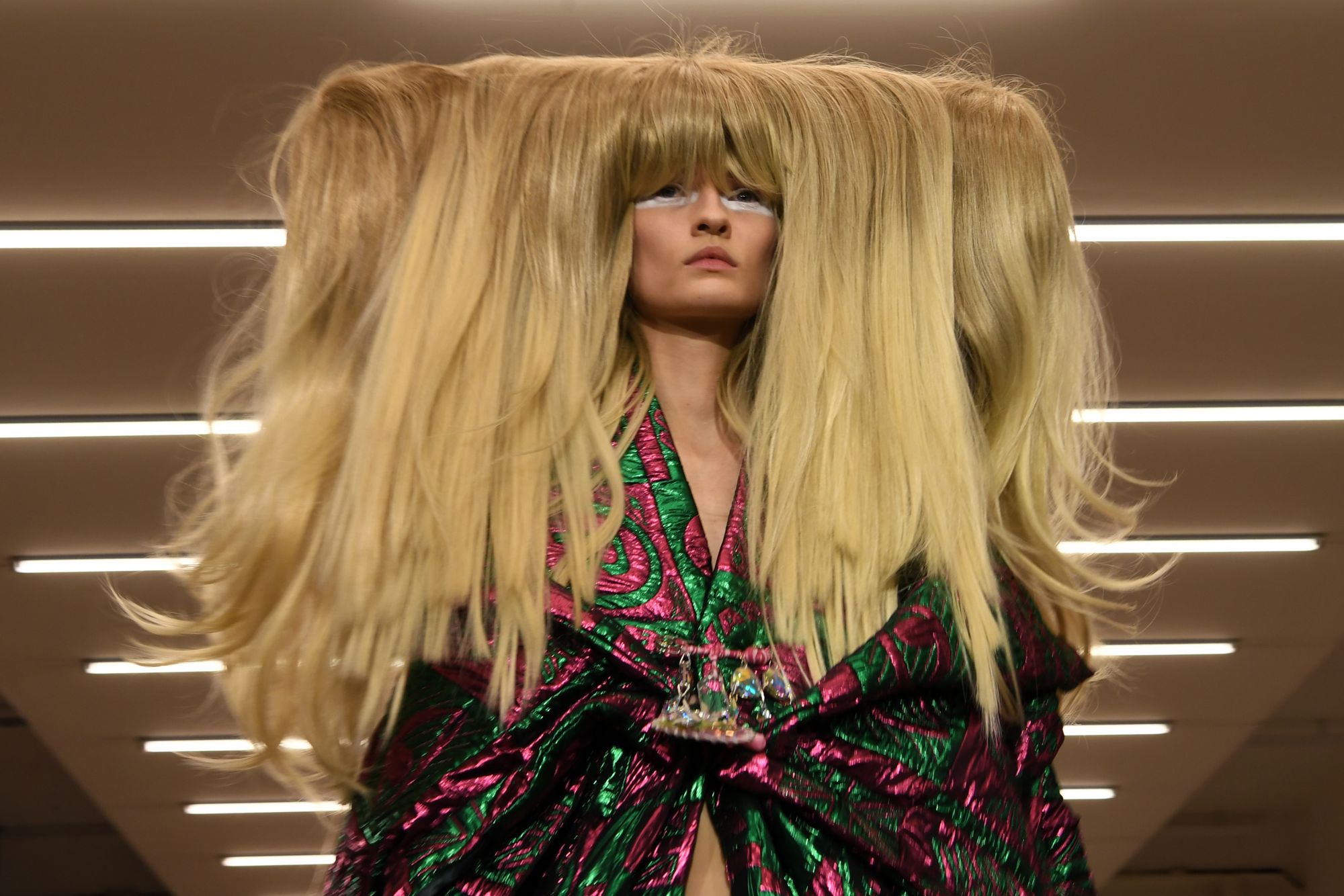 A model presents a creation by designer Matty Bovan during the catwalk show for their Autumn/Winter 2020 collection on the first day of London Fashion Week in London on February 14, 2020. (Photo by DANIEL LEAL-OLIVAS / AFP)