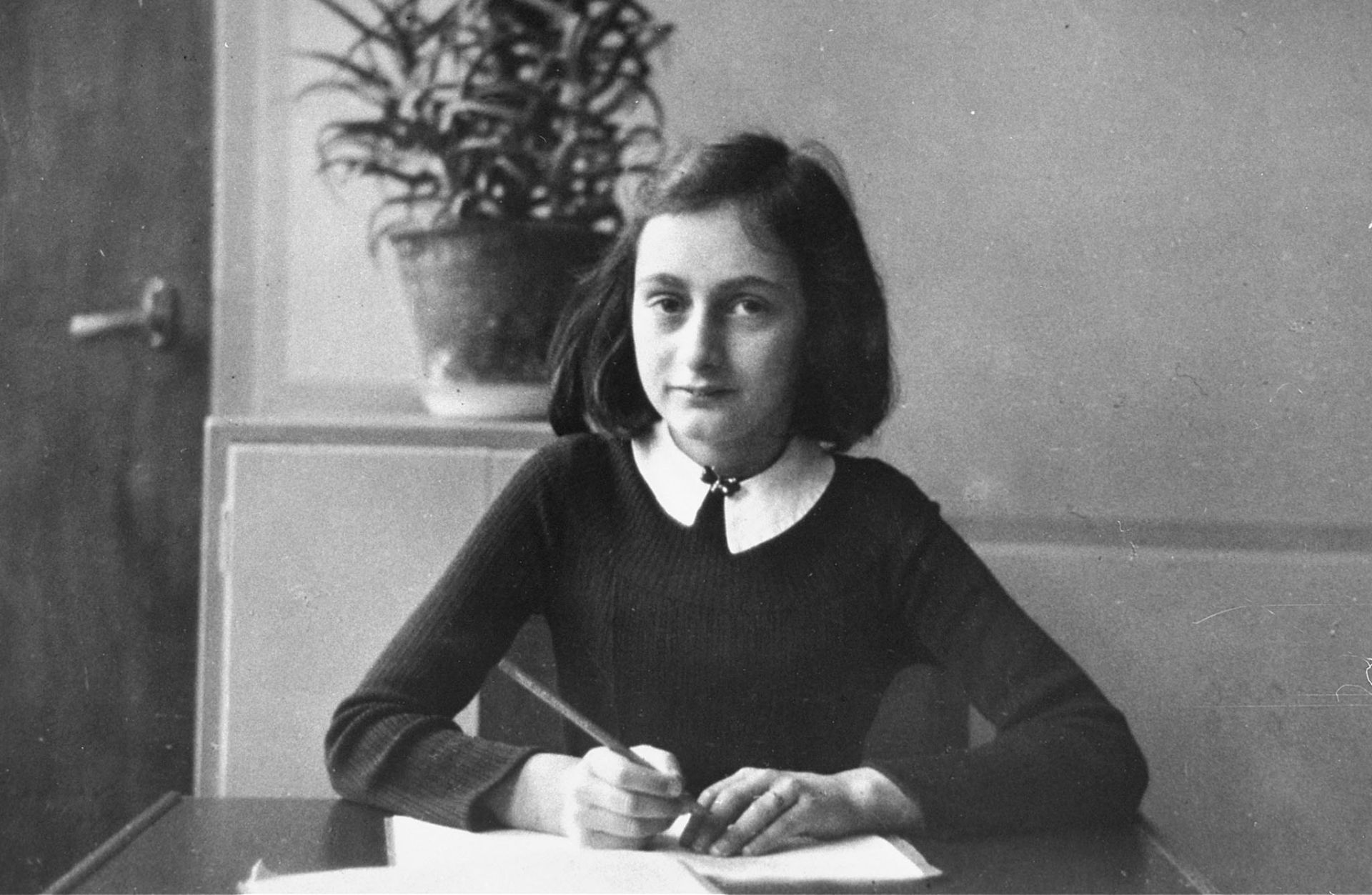 (FILES) This photo taken in 1940 shows Anne Frank at the age of 12 years, sitting at her desk at the Montessori school in Amsterdam. A new Anne Frank Exhibit opened 11 June 2003 at the United States Holocaust Memorial Museum in Washington,DC, commemorating its 10th anniversary. AFP PHOTO/HO