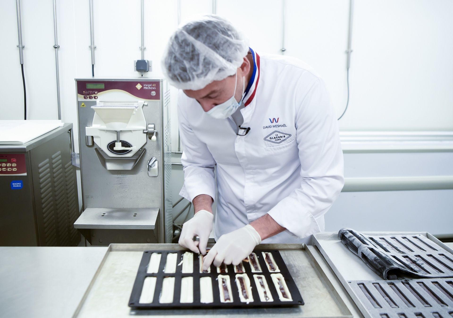 Ice cream maker David Wesmael, awarded "un des meilleurs ouvriers de France" (one of France's best craftsmen" is at work, on July 15, 2020, at his workshop in Lille. (Photo by FRANCOIS LO PRESTI / AFP)