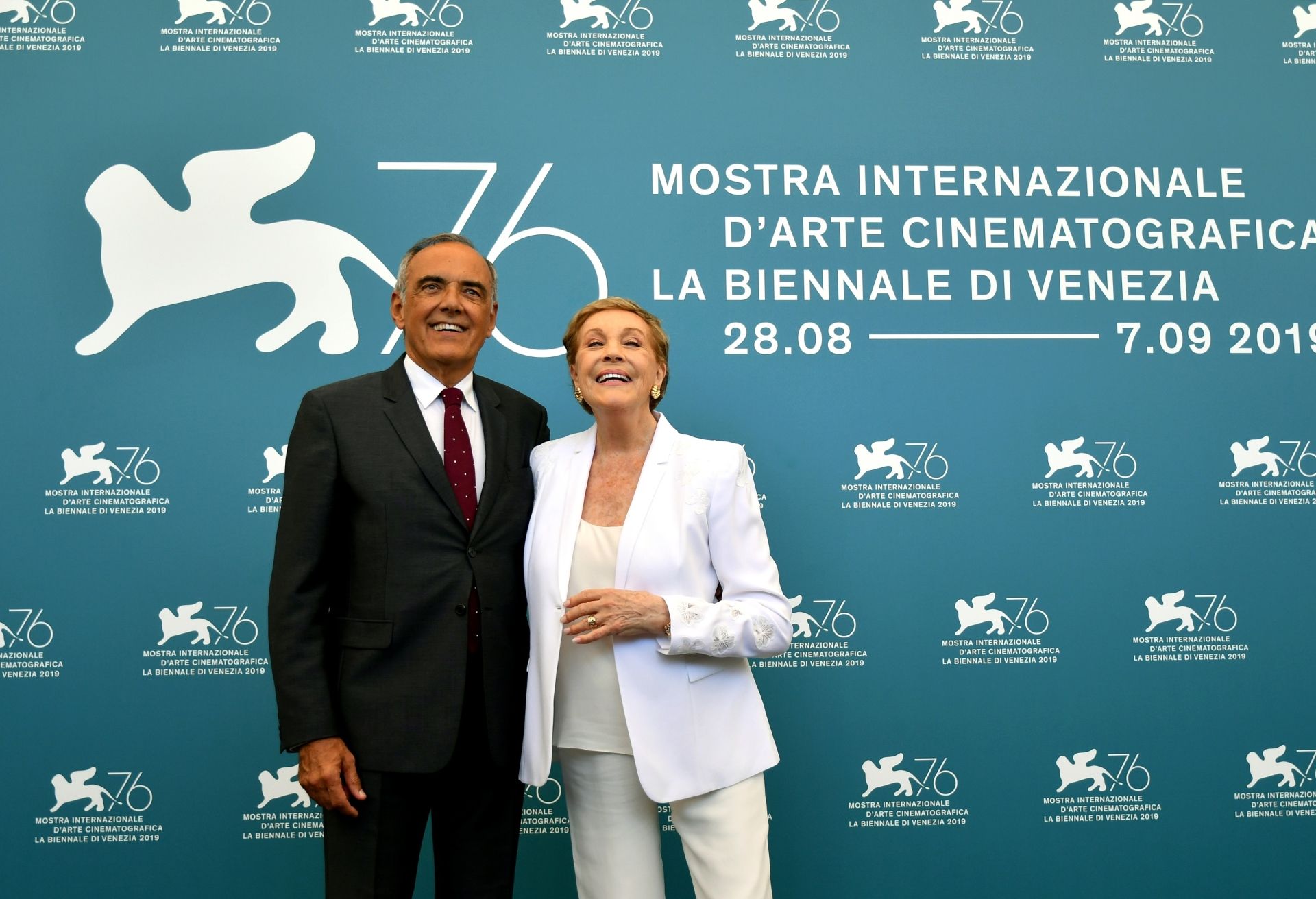 British actress Julie Andrews (R) and Director of the Venice International Film Festival Alberto Barbera pose during a photocall on September 3, 2019 during the 76th Venice Film Festival at Venice Lido. (Photo by Alberto PIZZOLI / AFP)