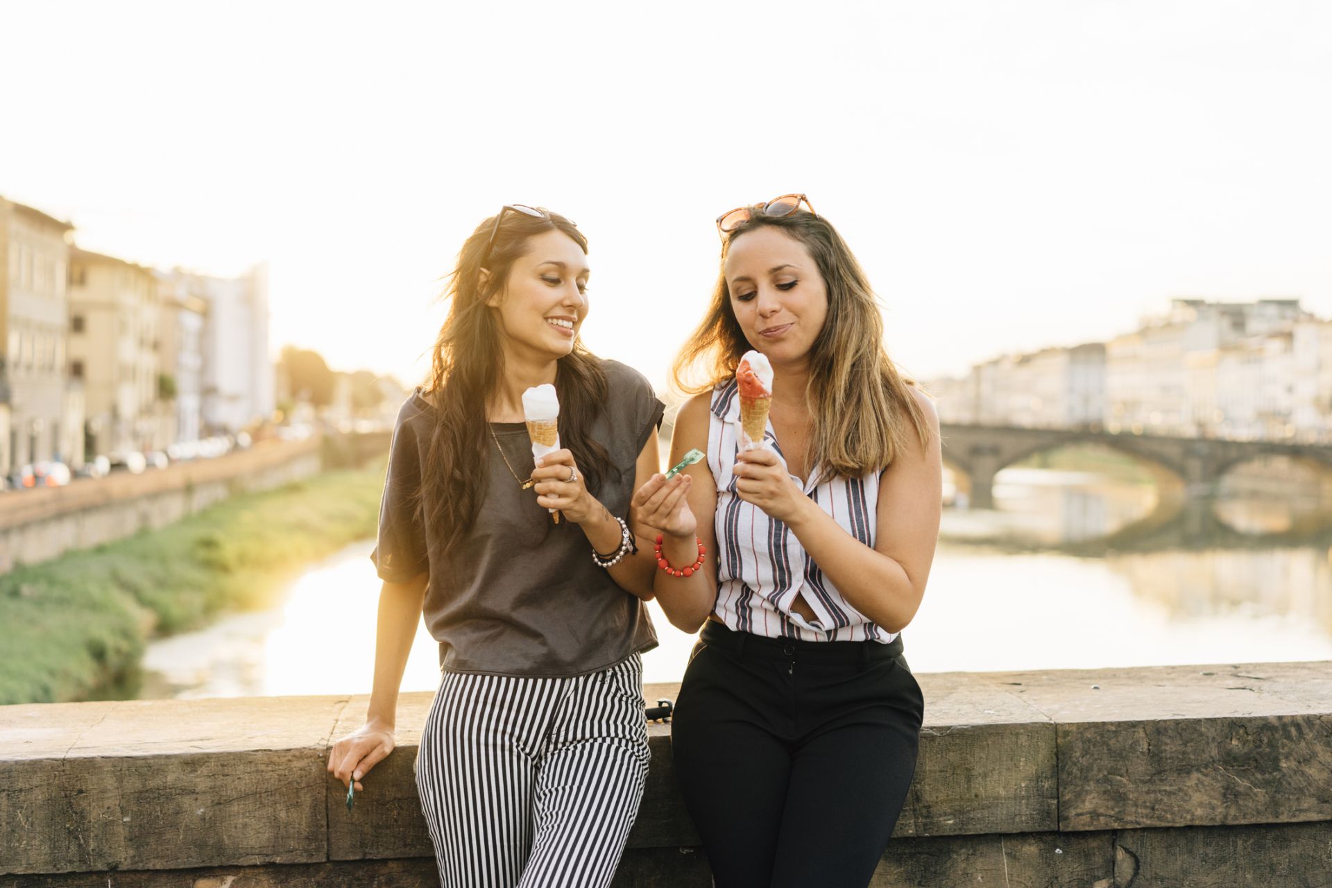 Two friends eating ice-cream together