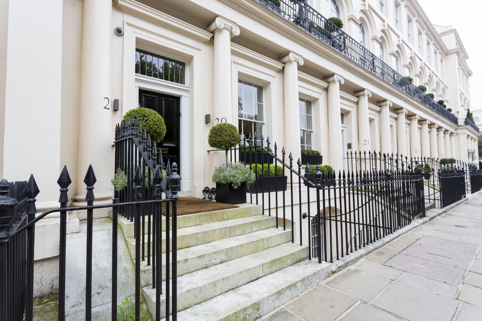 Typical white stuccoed terraced houses detail in London