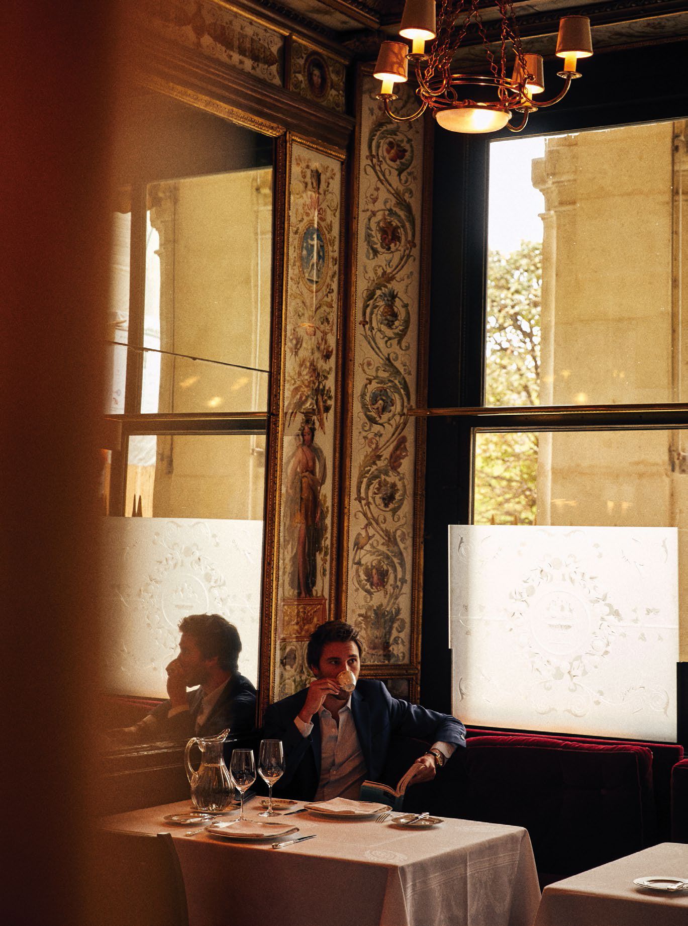 A candid photo of a man at a Parisian restaurant