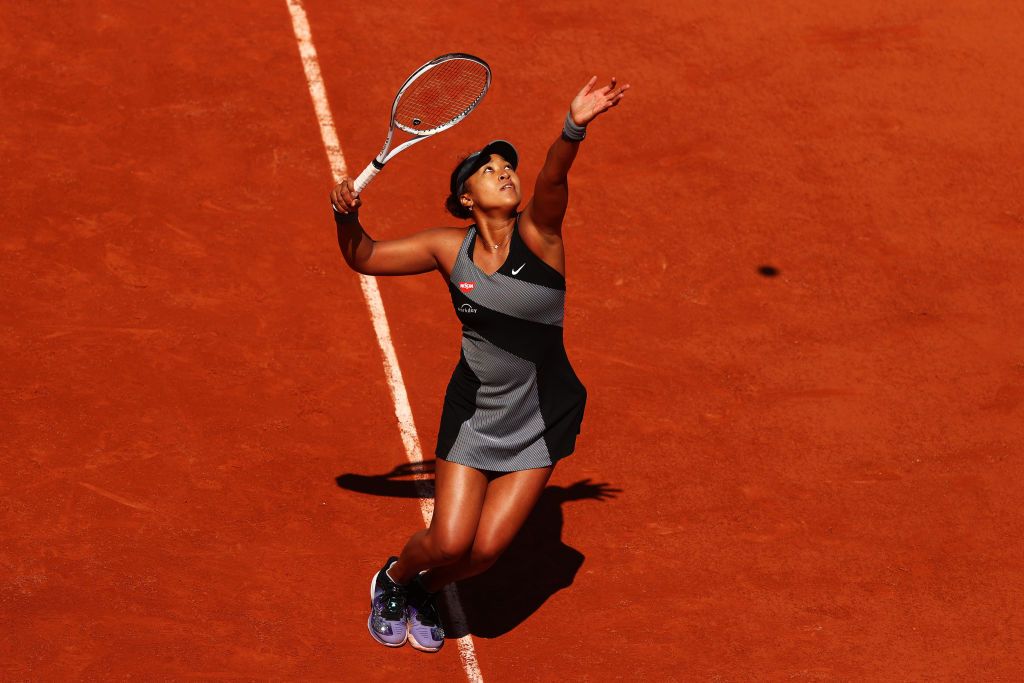 PARIS, FRANCE - MAY 30: Naomi Osaka of Japan serves in her First Round match against Patricia Maria Tig of Romania during Day One of the 2021 French Open at Roland Garros on May 30, 2021 in Paris, France. (Photo by Julian Finney/Getty Images)
