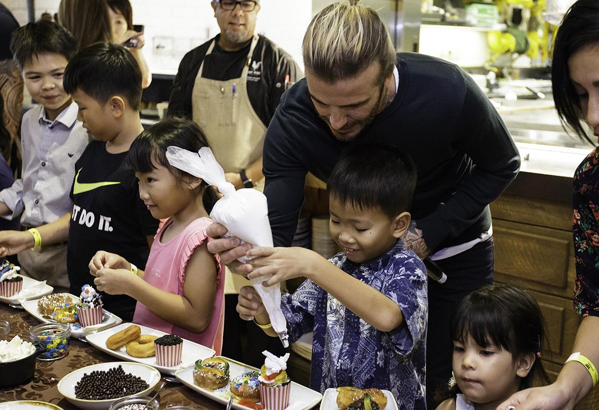 David Beckham interacted with the kids at the pastry-making workshop.
