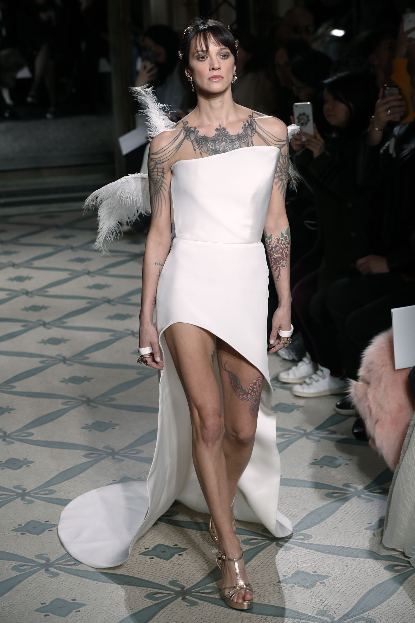 In a high point of the Antonio Grimaldi show, Asia Argento walked the runway in a short dress with a train and feathers. Paris, January 21, 2019; Image: Courtesy of Francois Guillot/AFP