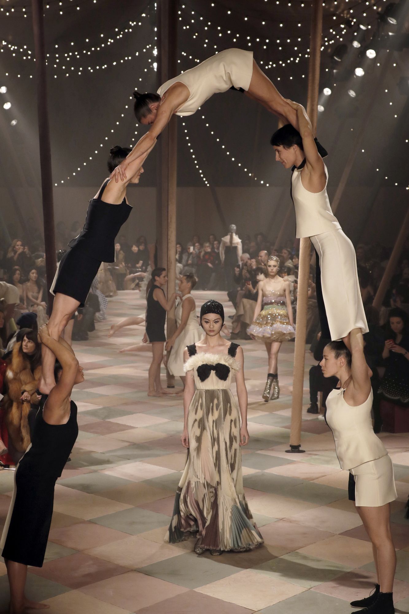 The 2019 Spring-Summer Collection by Dior, was inspired by circus looks and performers, notably present in this dramatic human arch. Paris, January 21, 2019; Image: Courtesy of Francois Guillot/AFP