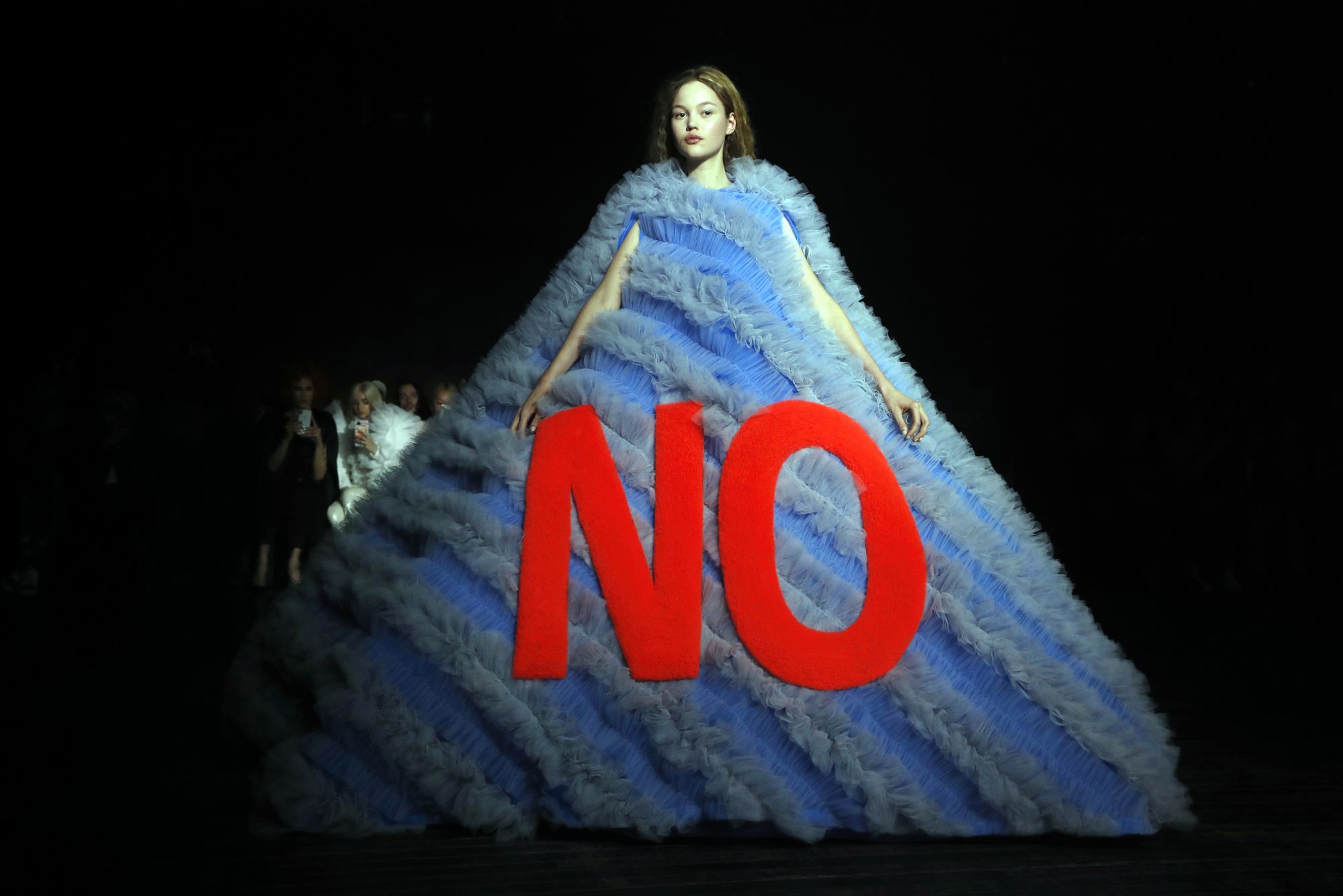 Among the many voluminous and imposing dresses by Viktor & Rolf, one outstandingly poetic creation took the form of a sublime pyramid emblazoned with the word 'No'