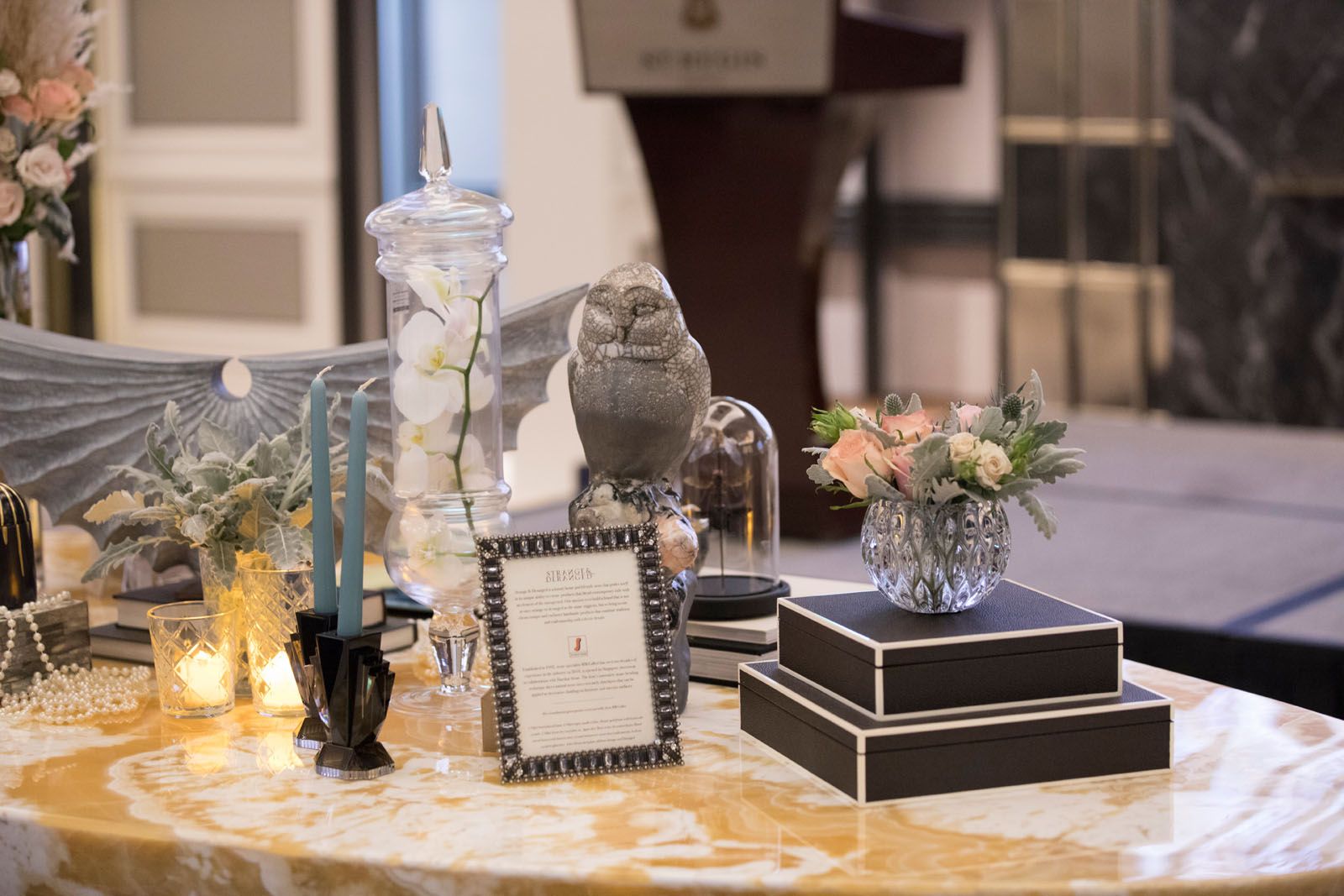 Accessories from Strange & Deranged and floral arrangement by Beato, displayed on the Hive onyx table from MM Galleri