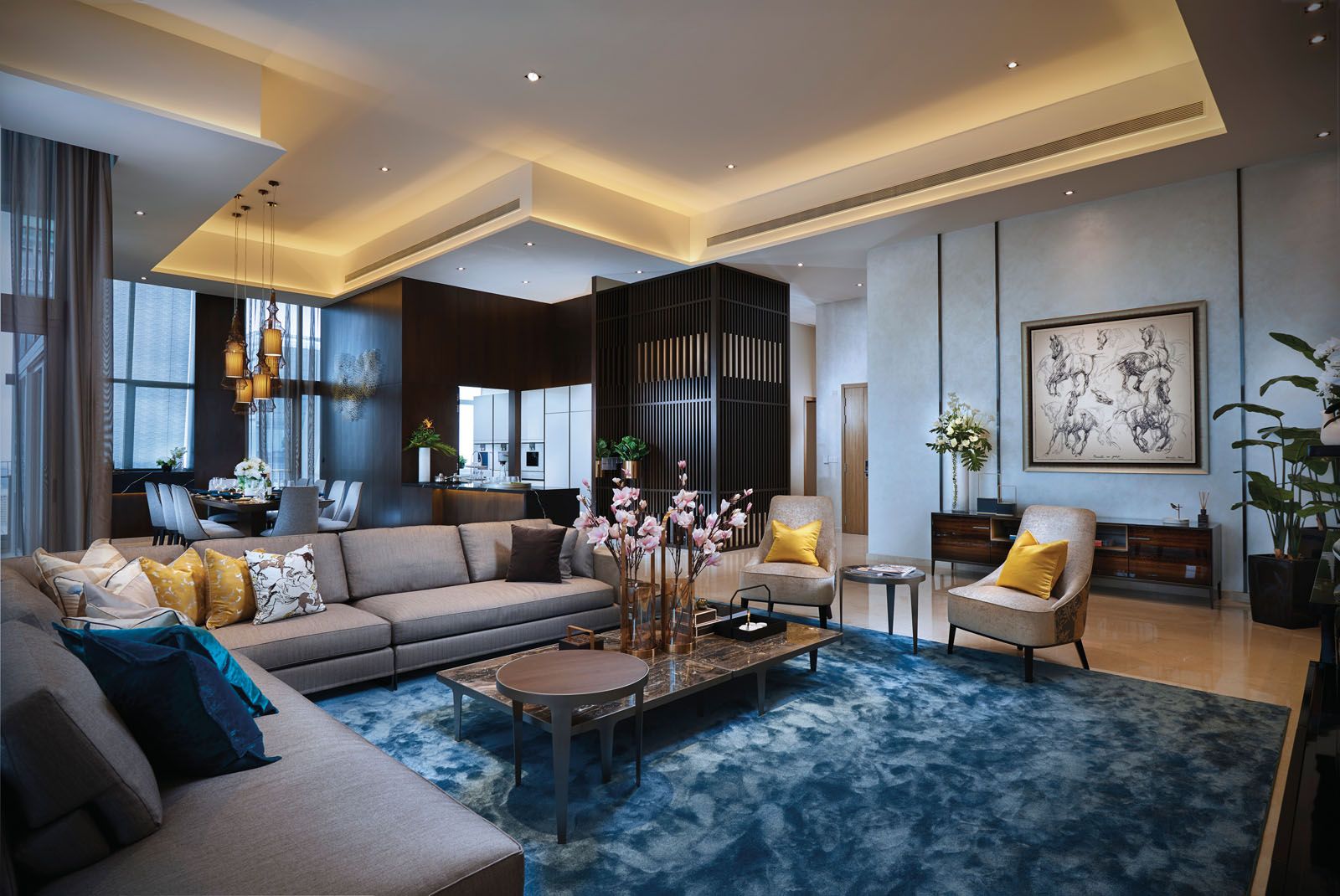 A lively mix of mustard and blue tones invigorate the living area of the penthouse