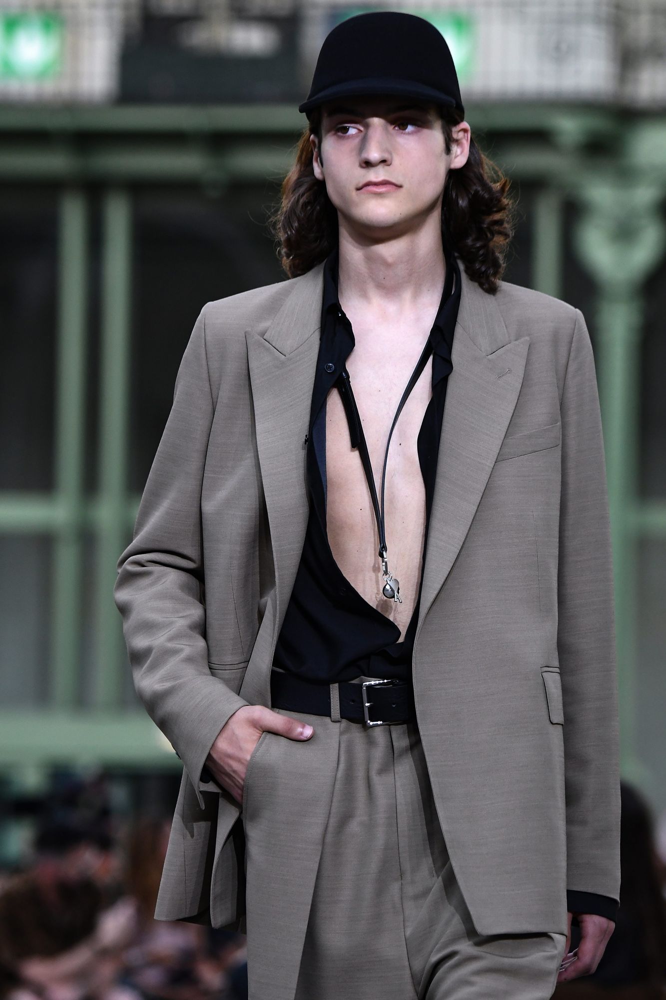 The extra-long necklace (worn over bare chest) by AMI Alexandre Mattiussi (Photo: Niklas Halle'n / AFP)