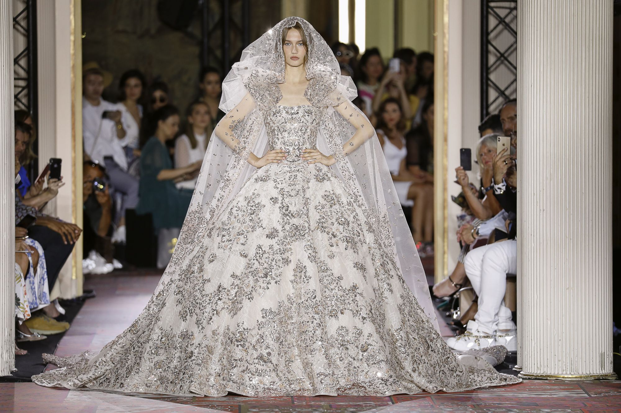 Zuhair Murad Haute Couture Fall/Winter 2019: An ivory-colored dress with shimmering crystals, silk tulle veil covered in crystals and silvery sequins (Image: Zuhair Murad Couture)