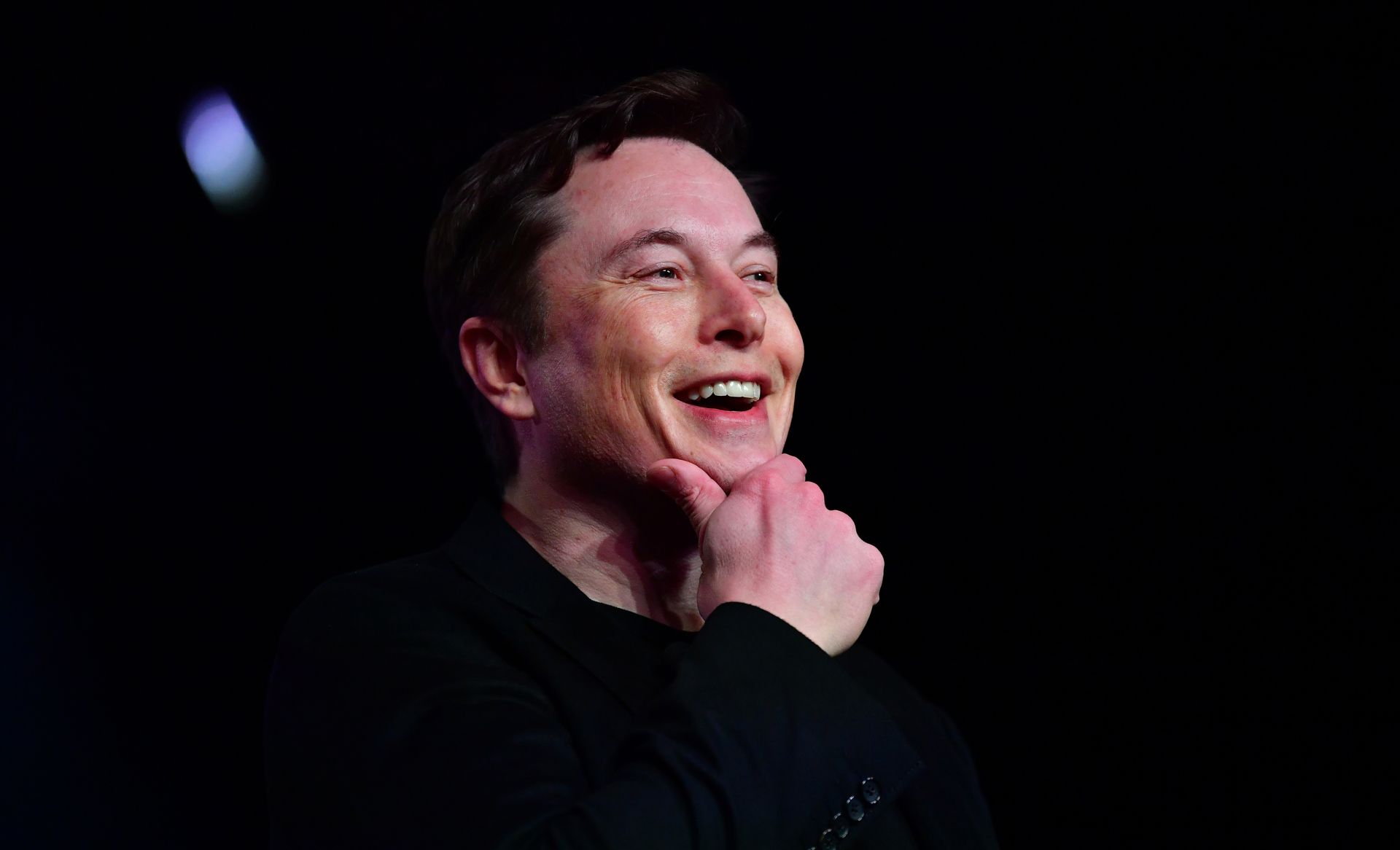 (FILES) In this file photo taken on March 14, 2019 Tesla CEO Elon Musk speaks during the unveiling of the new Tesla Model Y in Hawthorne, California. - Futurist entrepreneur Elon Musk late July 16, 2019, revealed his secretive Neuralink startup is making progress on an interface linking brains with computers, and said they hope to begin testing on people next year. (Photo by Frederic J. BROWN / AFP)