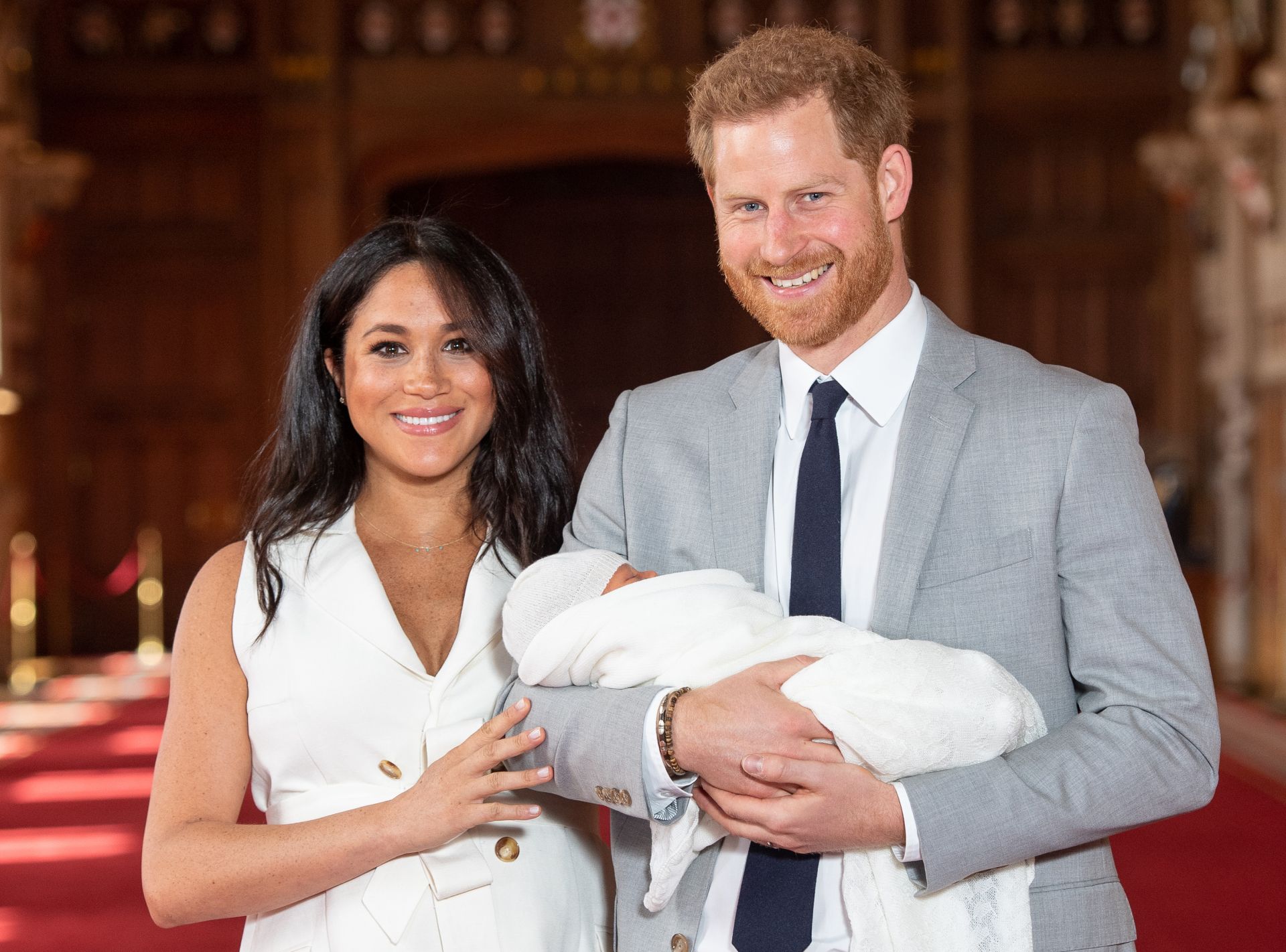 Britain's Prince Harry, Duke of Sussex (R), and his wife Meghan, Duchess of Sussex, pose for a photo with their newborn baby son in St George's Hall at Windsor Castle in Windsor, west of London on May 8, 2019. (Photo by Dominic Lipinski / POOL / AFP)