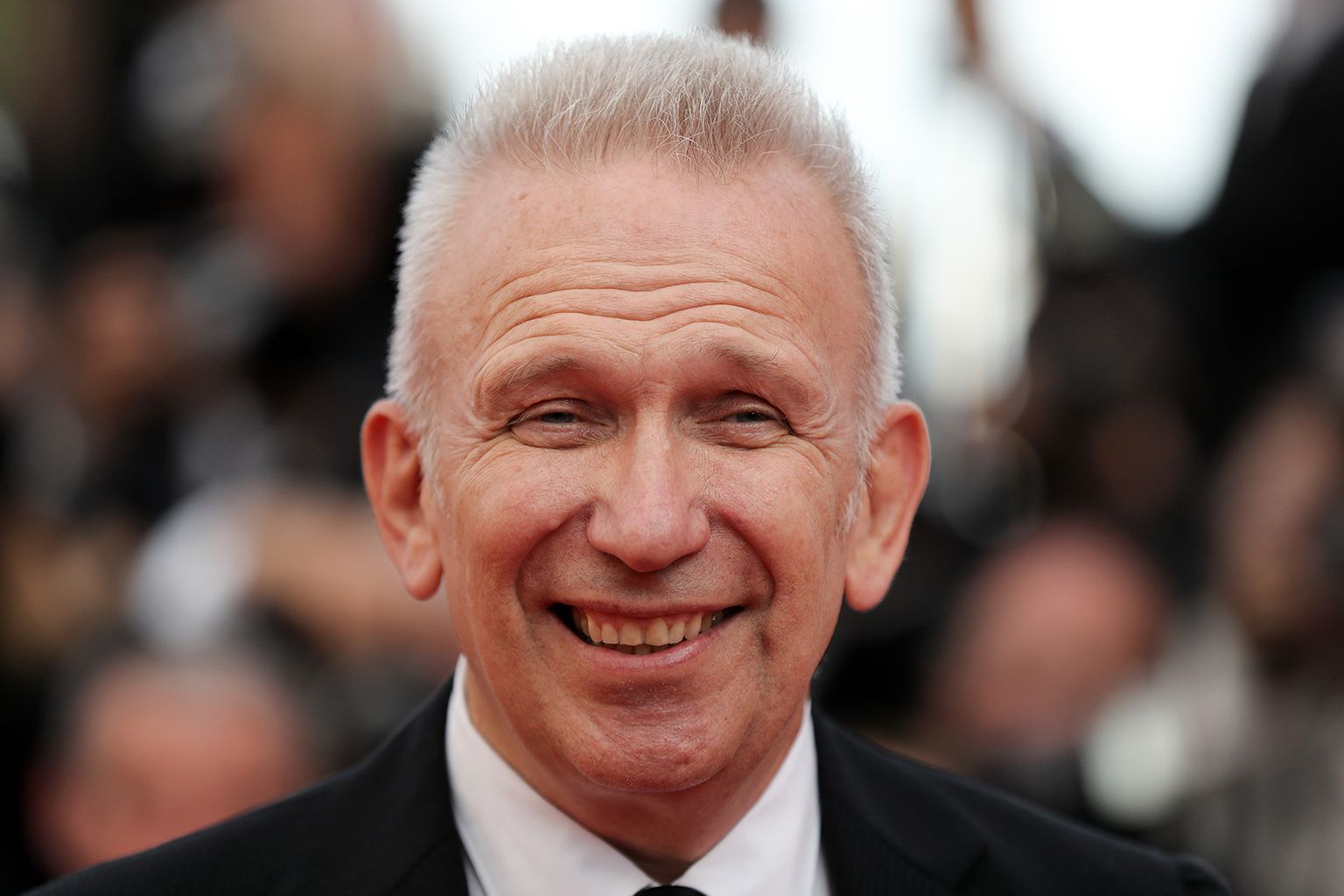(FILES) This file photo taken on May 23, 2017 shows French fashion designer Jean-Paul Gaultier arriving for the "70th Anniversary" ceremony of the Cannes Film Festival in Cannes, southern France. In October 2018, Jean Paul Gaultier, will sign and stage at the Folies Bergeres a show evoking his career through half a century of pop culture and fashion, he told AFP on November 8, 2017. / AFP PHOTO / Valery HACHE