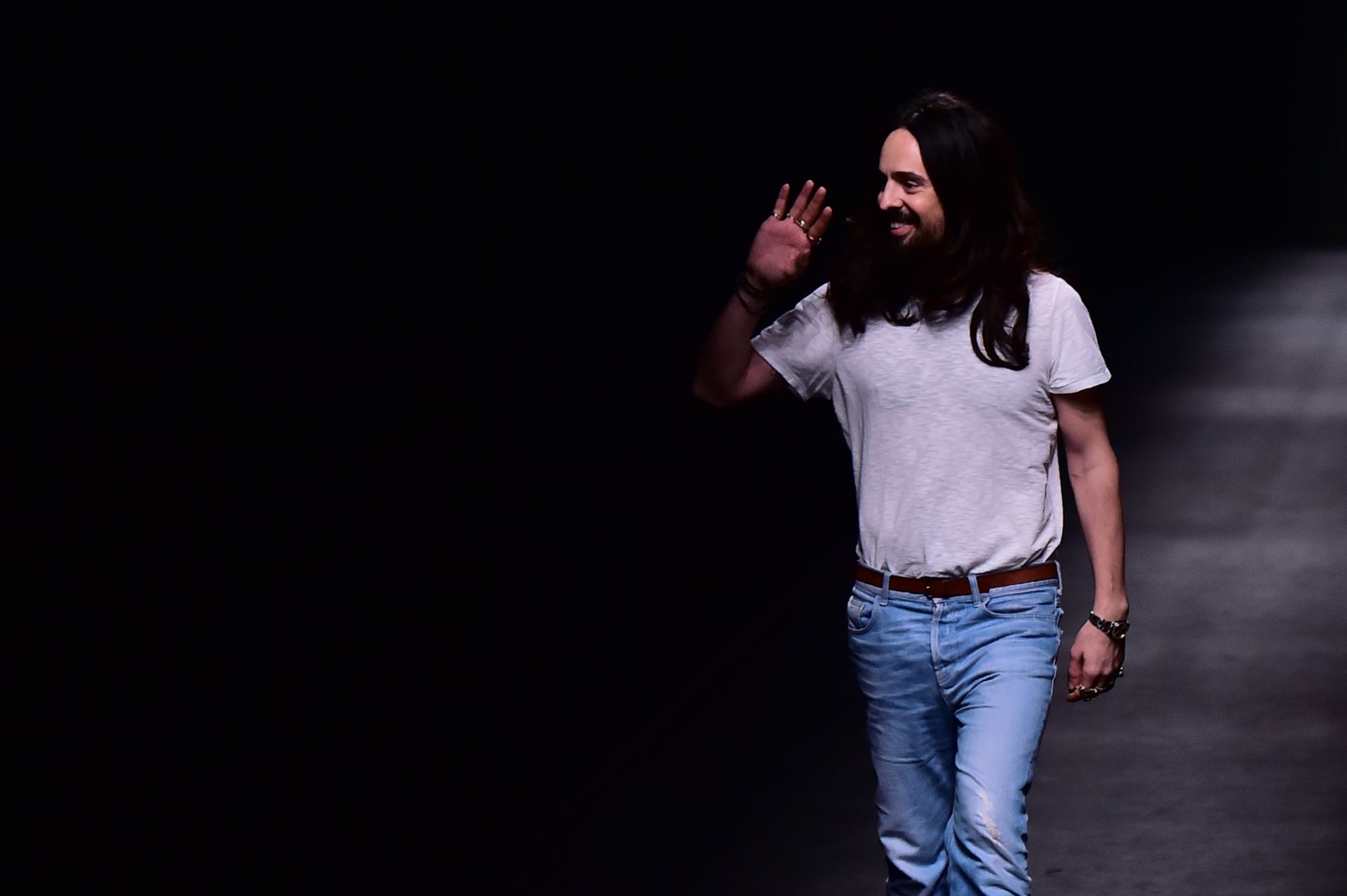 Designer Alessandro Michele walks the runway at the end of the show for fashion house Gucci during the Autumn-Winter 2016 / 2017 Milan Fashion Week on February 24, 2016. / AFP / GIUSEPPE CACACE
