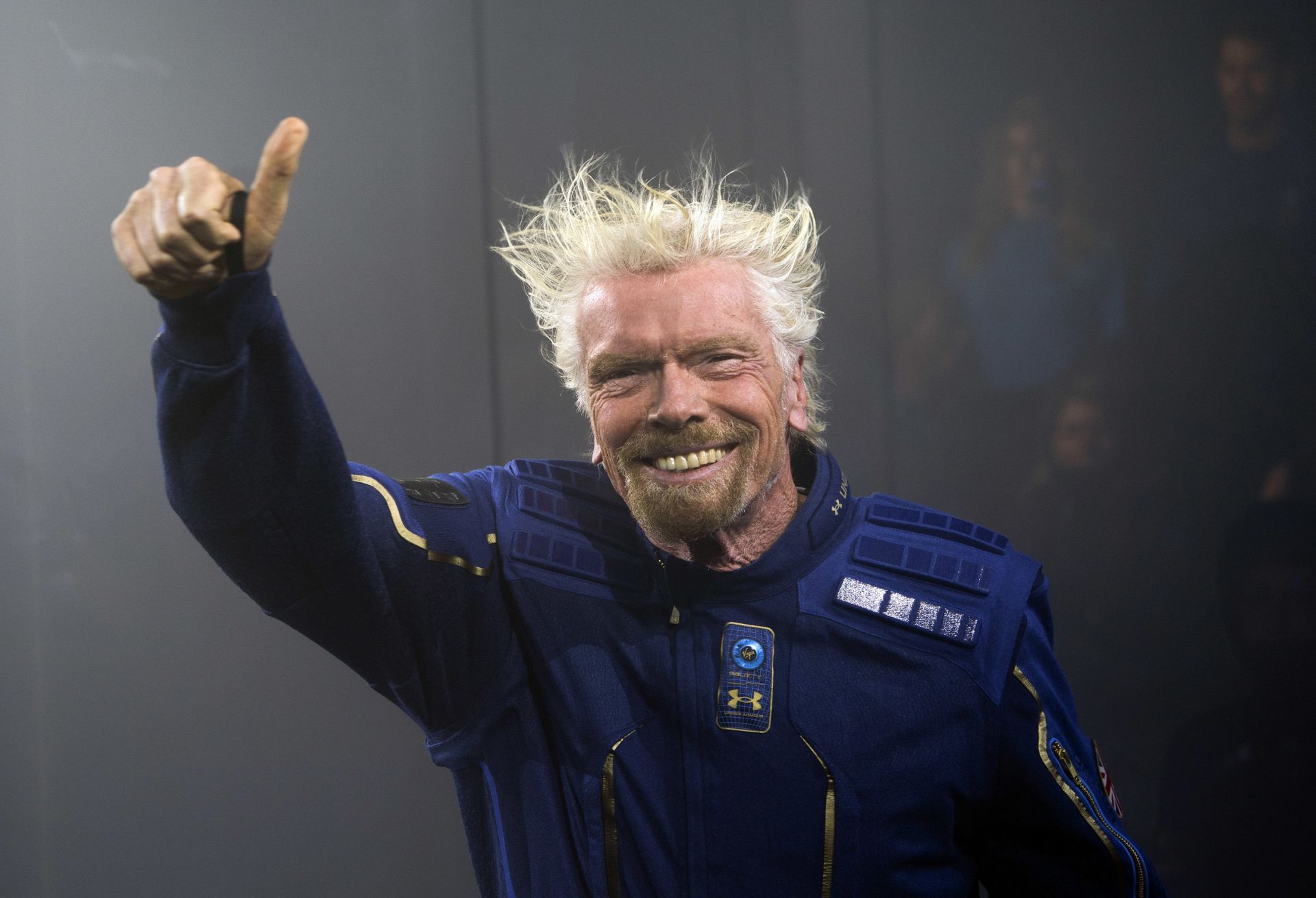 Virgin Galactic Founder Sir Richard Branson demonstrates a spacewear system, designed for Virgin Galactic astronauts, at an event October 16, 2019 in Yonkers, New York. - At the event Virgin Galactic and Under Armour unveiled the worldÃs first exclusive spacewear system for private astronauts. (Photo by Don Emmert / AFP)