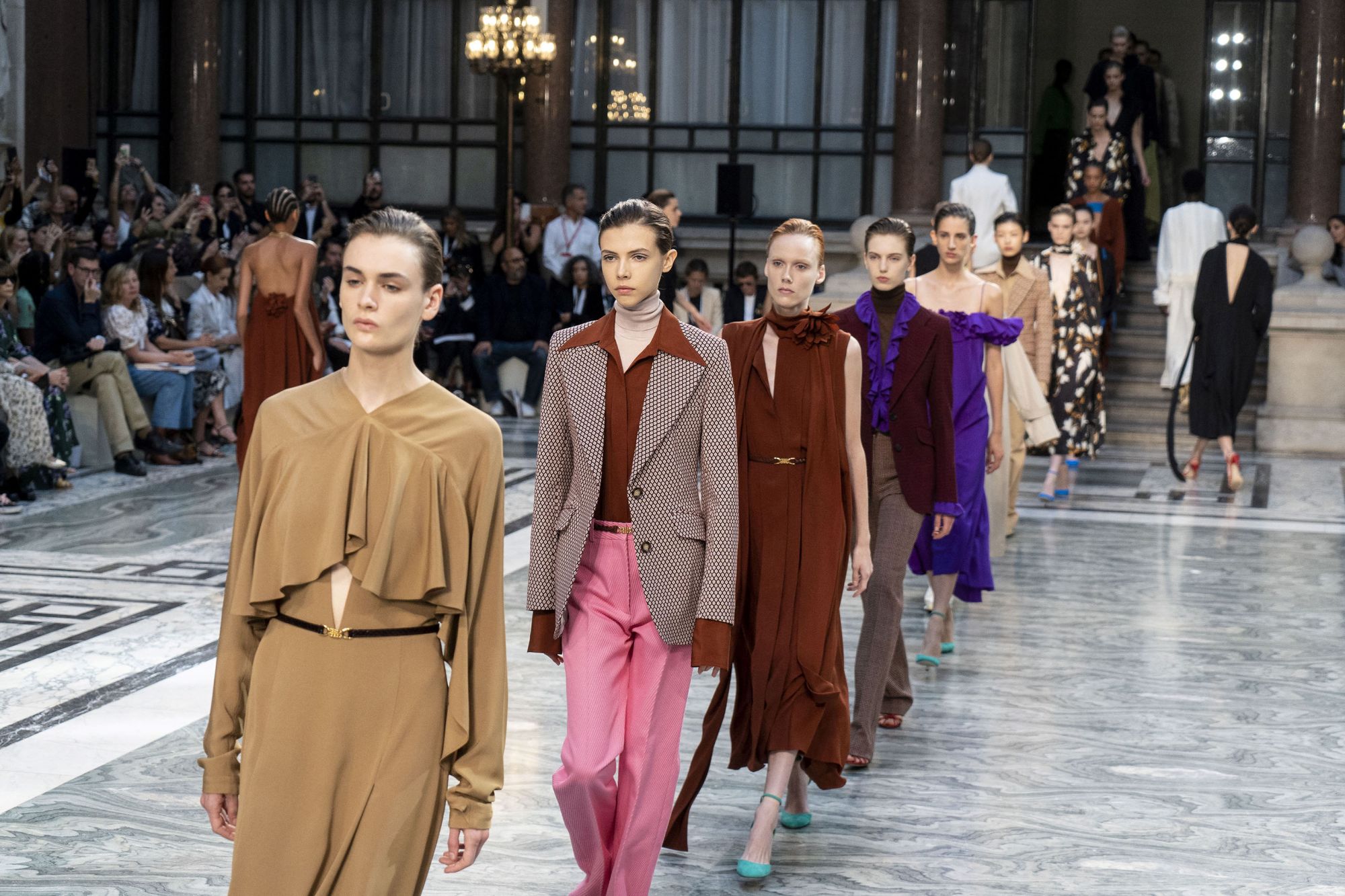(FILES) In this file photo taken on September 15, 2019 Models present creations from designer Victoria Beckham during a catwalk show for the Spring/Summer 2020 collection on the third day of London Fashion Week in London on September 15, 2019. - London Fashion Week, which begins on February 19, 2021, has shifted to a virtual format amid Britain's Covid lockdown and while usual mainstays like Victoria Beckham won't be parcitipating, designers like Burberry have embraced the online show. (Photo by Niklas HALL