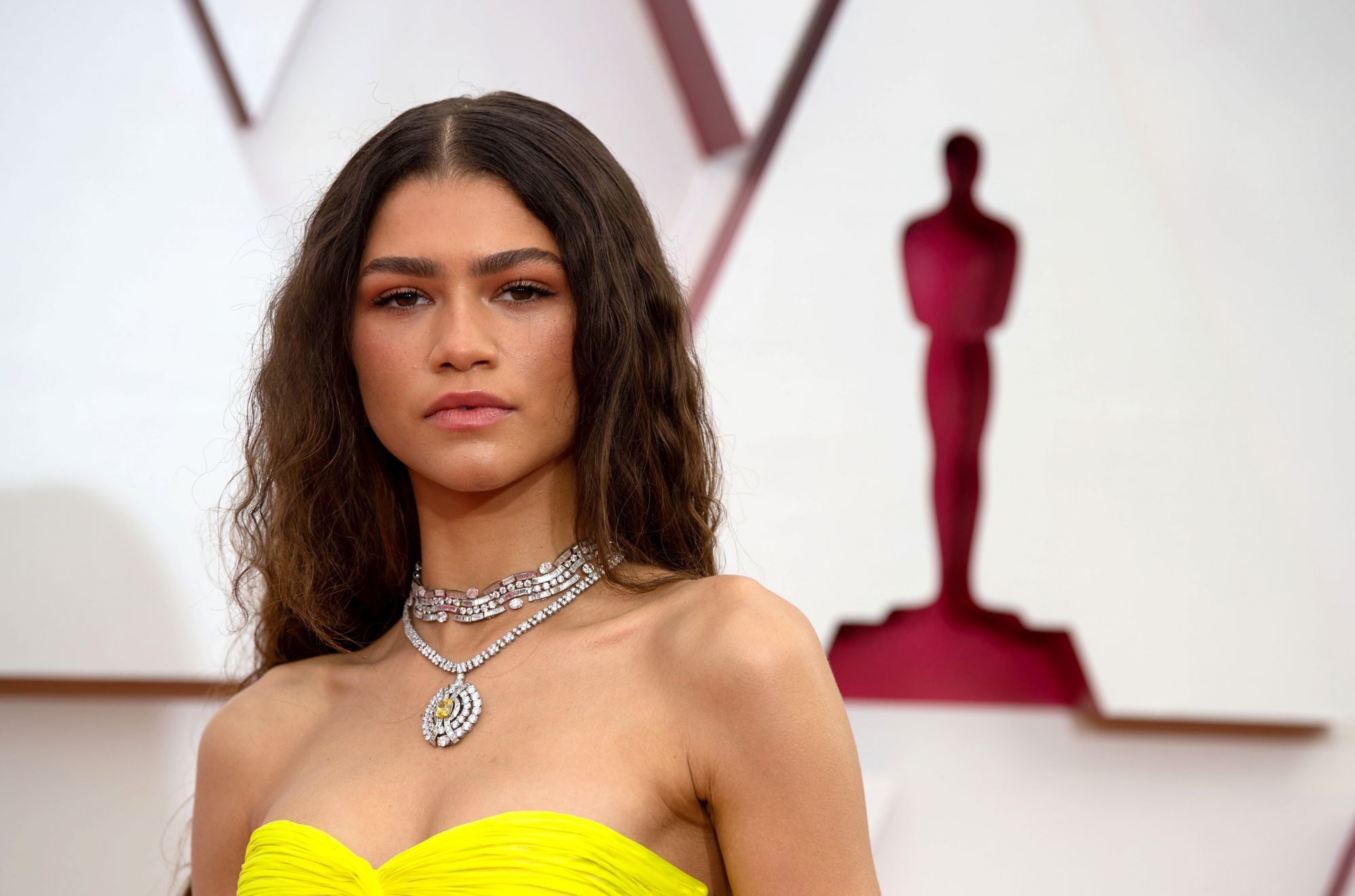 Zendaya's centre-parted hair made waves on the red carpet. (Image: Matt Petit/A.M.P.A.S. via Getty Images)