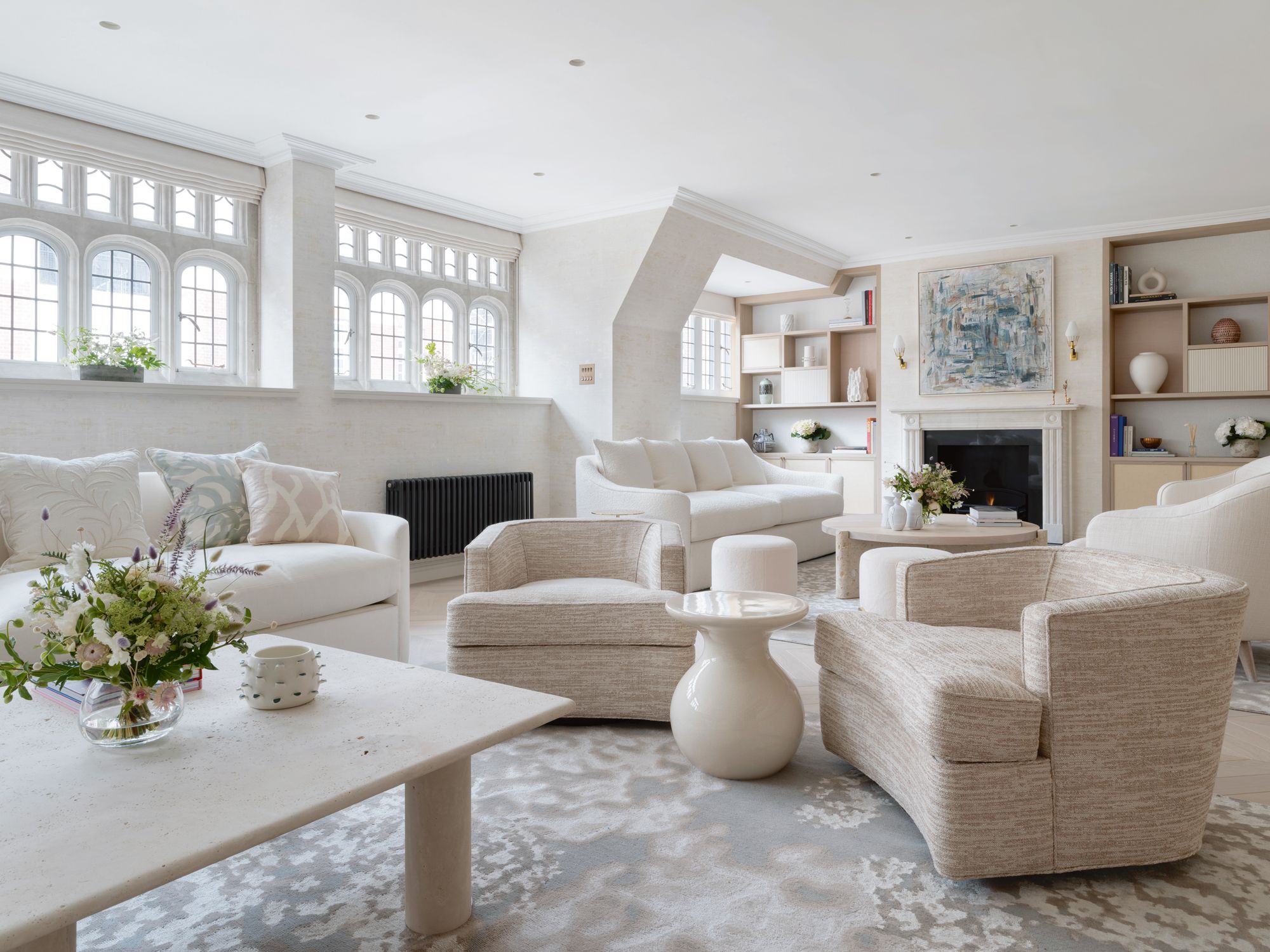 Beige, cream and off-white tones contribute to the lofty look of the living room