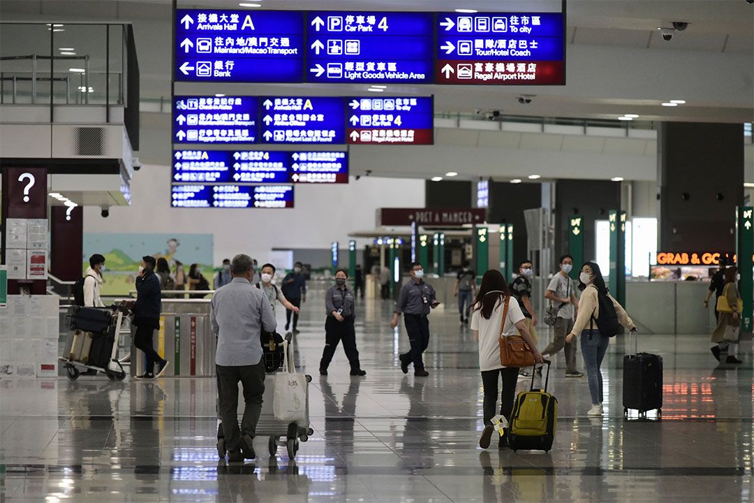 Hong Kong residents arrives at the arrival hall of the Hong Kong International Airport. Photo: Li Zhihua/China News Service via Getty Images