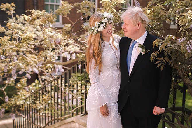 Prime Minister Boris Johnson poses with his wife Carrie Johnson in the garden of 10 Downing Street following their wedding. Photo: Rebecca Fulton / Downing Street via Getty Images