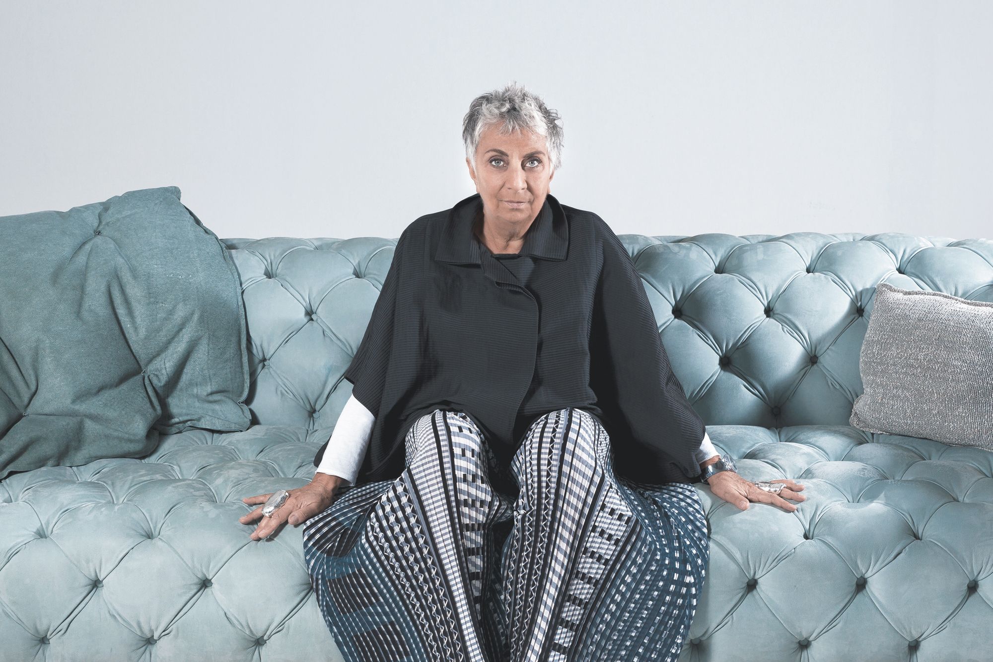 Paola Navone, pictured on the Baxter Chester Moon sofa