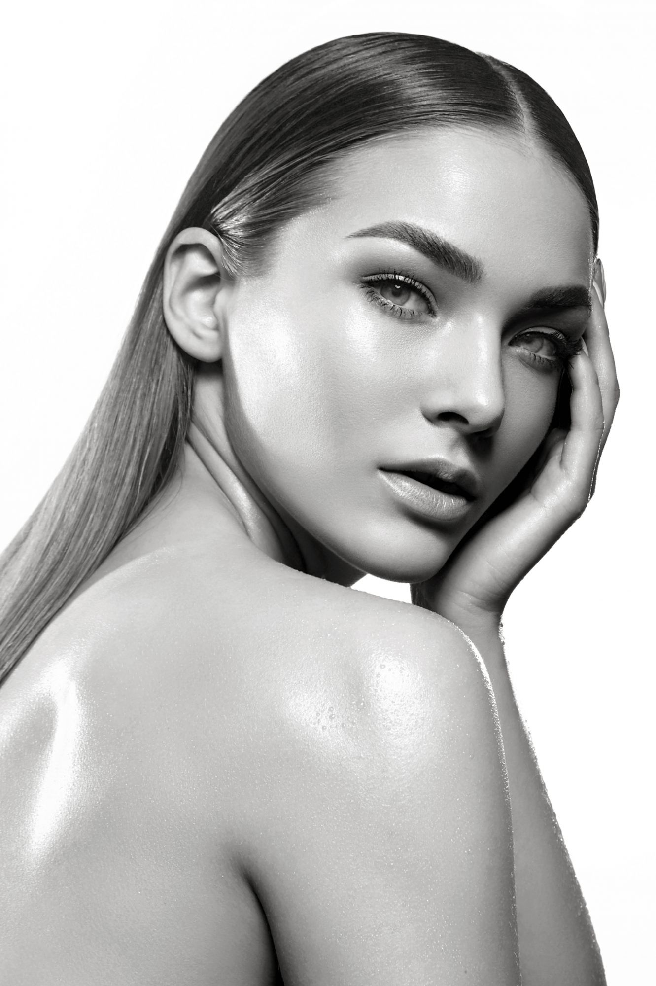 Black and white portrait of a beautiful young girl with natural make-up and well-groomed hair on a white background in the studio.; Shutterstock ID 1609603774; Purchase Order: -