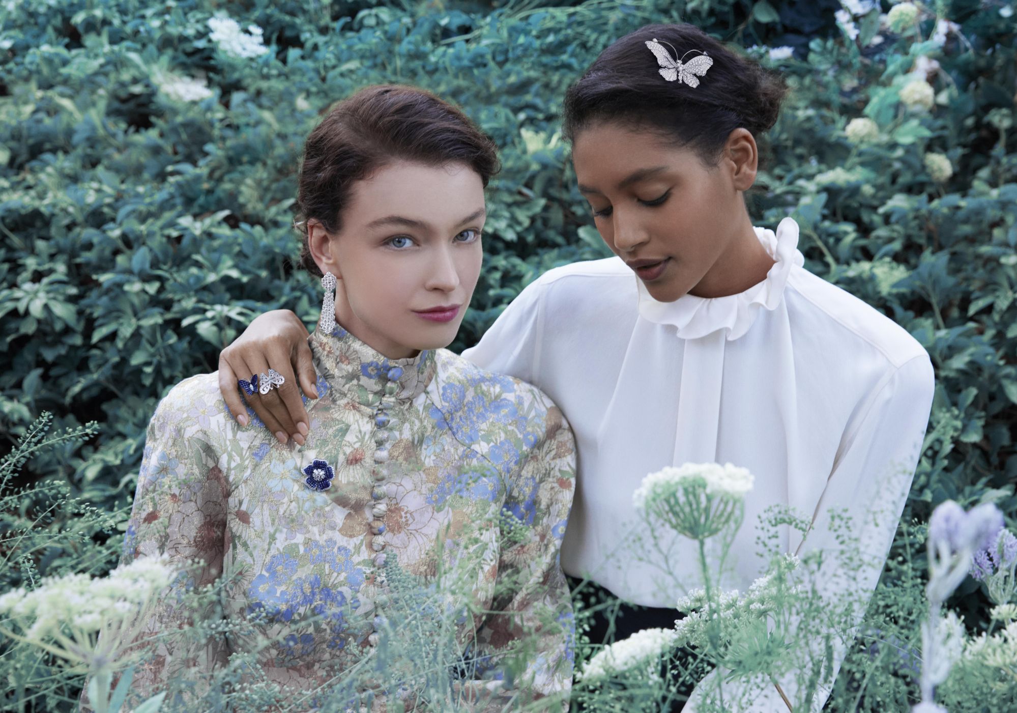 Photo by Erik Madigan Heck - Spring shooting 2021Ã Cheval earrings with detachable pendants, platinum, white gold, diamondsPetit Gloxinia clip, platinum, rose gold, white gold, Traditional Mystery Set sapphires, diamondsFlying Butterfly Between the Finger Ring, white gold, rose gold, buff-topped Traditional Mystery Set sapphires, diamondsBelle-dame butterfly clip, white gold, diamonds