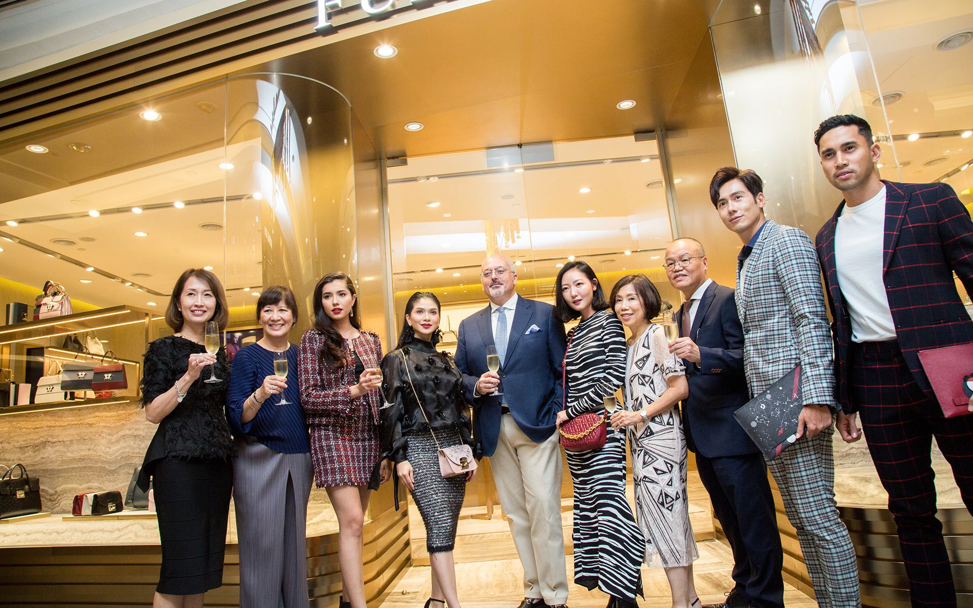 Furla CEO of Asia Pacific Alessandro Bartoli (centre) officiates the store opening with celebrity guests