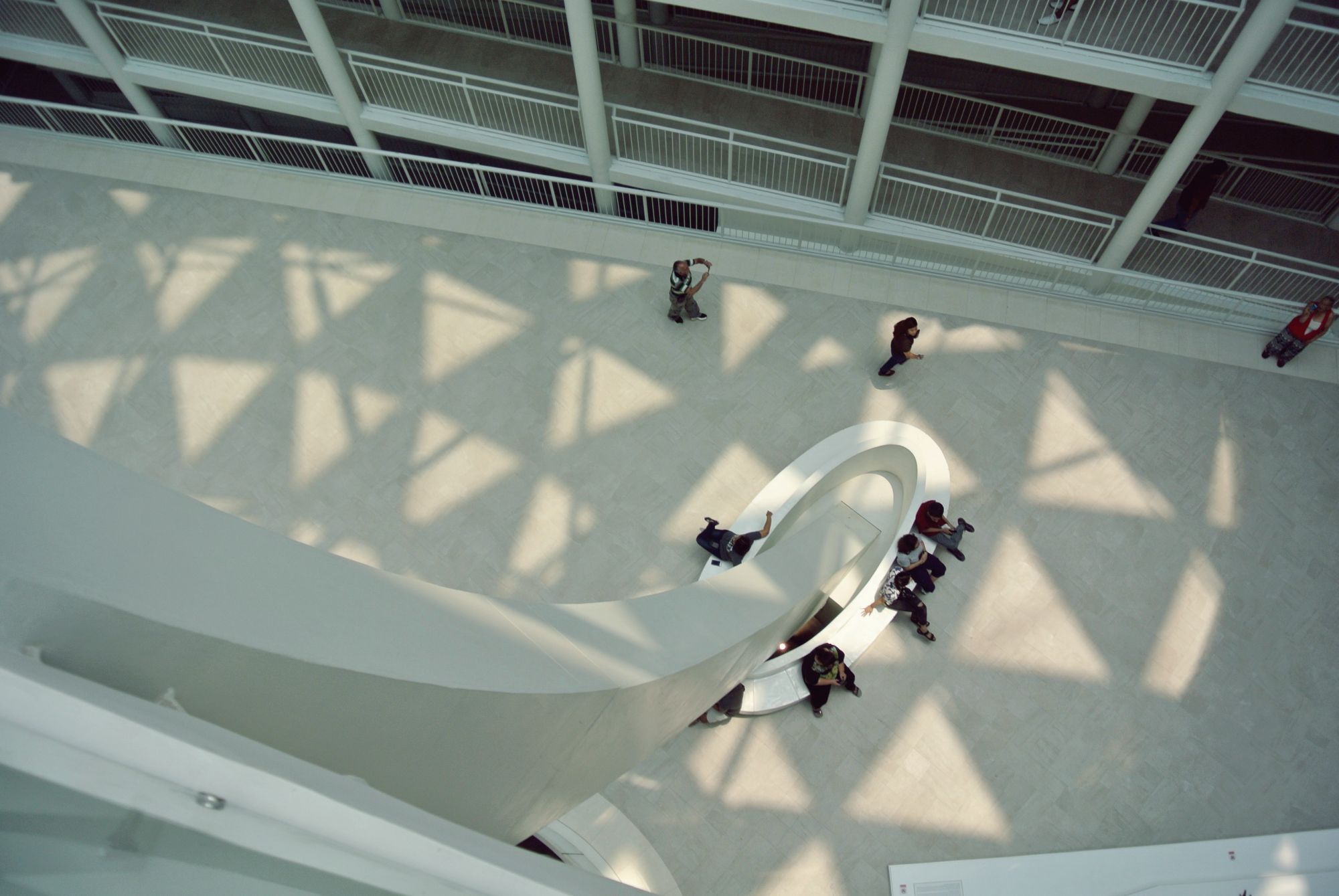 The ceiling design creates picturesque sunlight patterns on the courtyard floor.