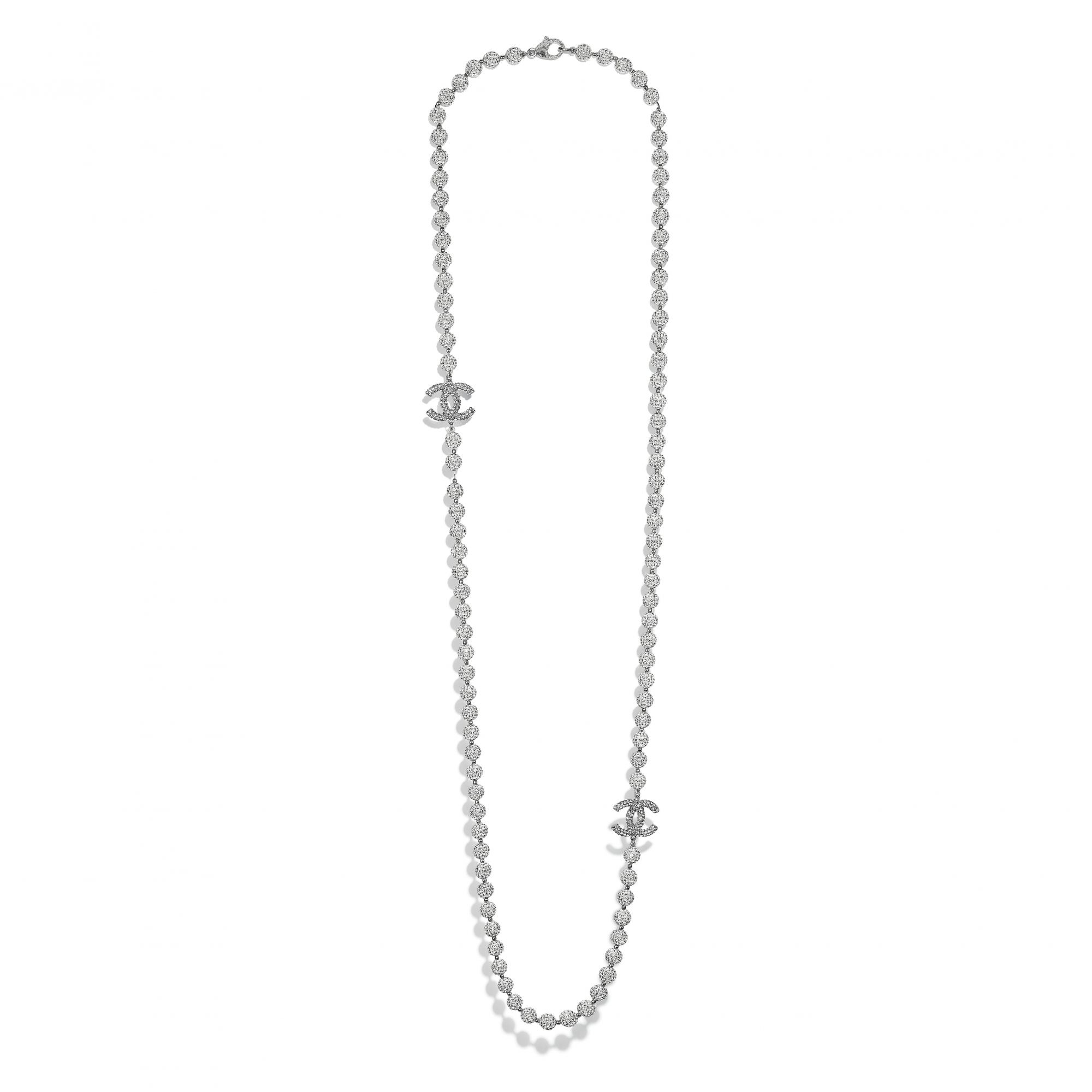 Long necklace in metal, strass, resin and ceramic