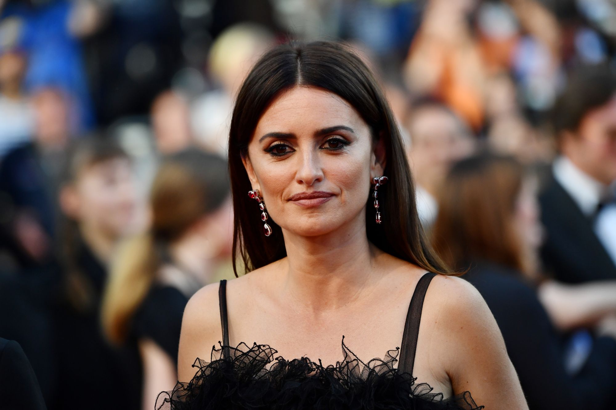 Penelope Cruz wore 18-carat white gold, diamond and ruby earrings from her new sustainable fine jewelry collection with Atelier Swarovski, which will be unveiled in July.