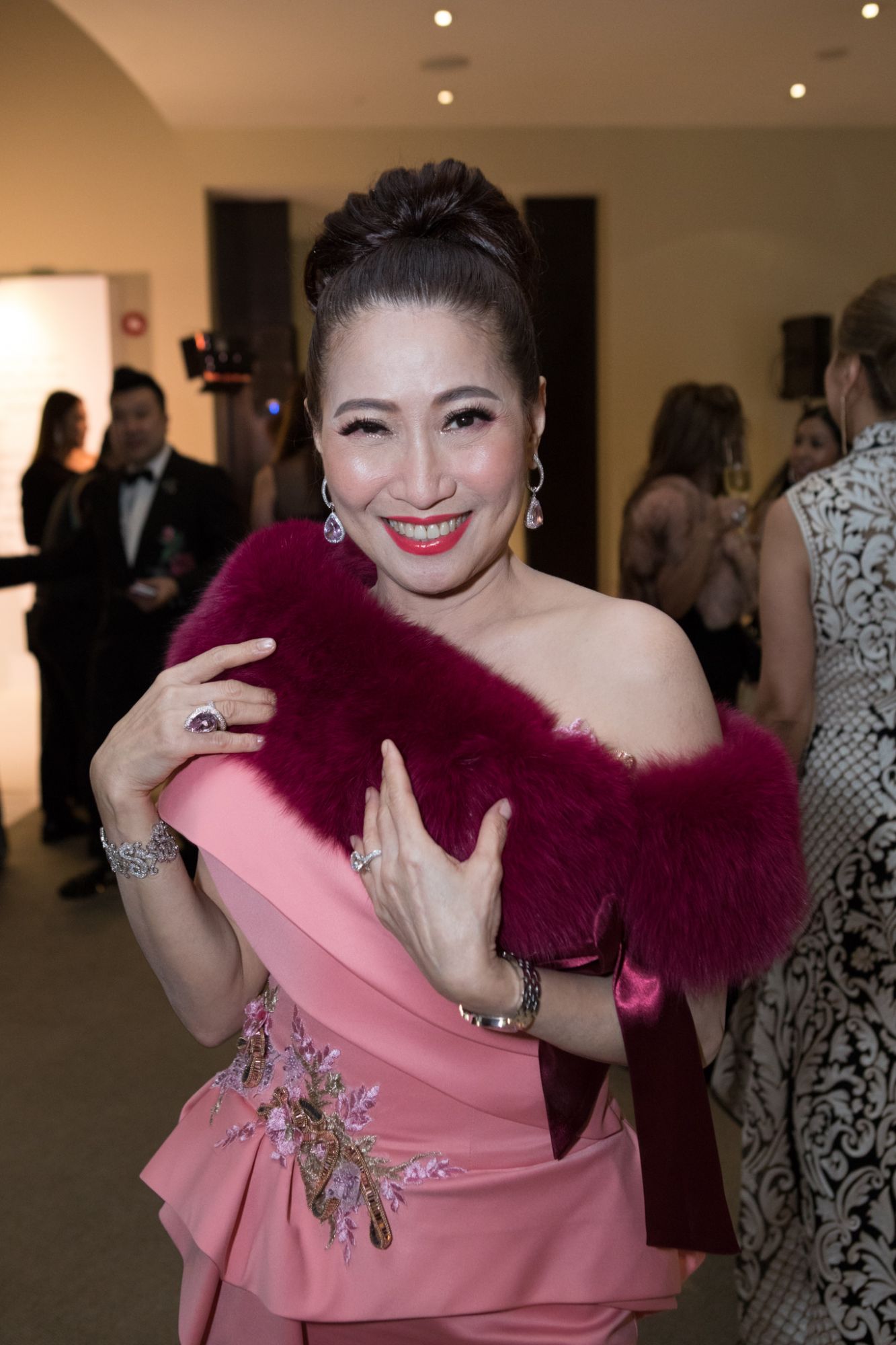 Tan Khar Nai. Earrings, ring and bracelet by Yuli Inc. Fine Jewellery, watch by Chopard.