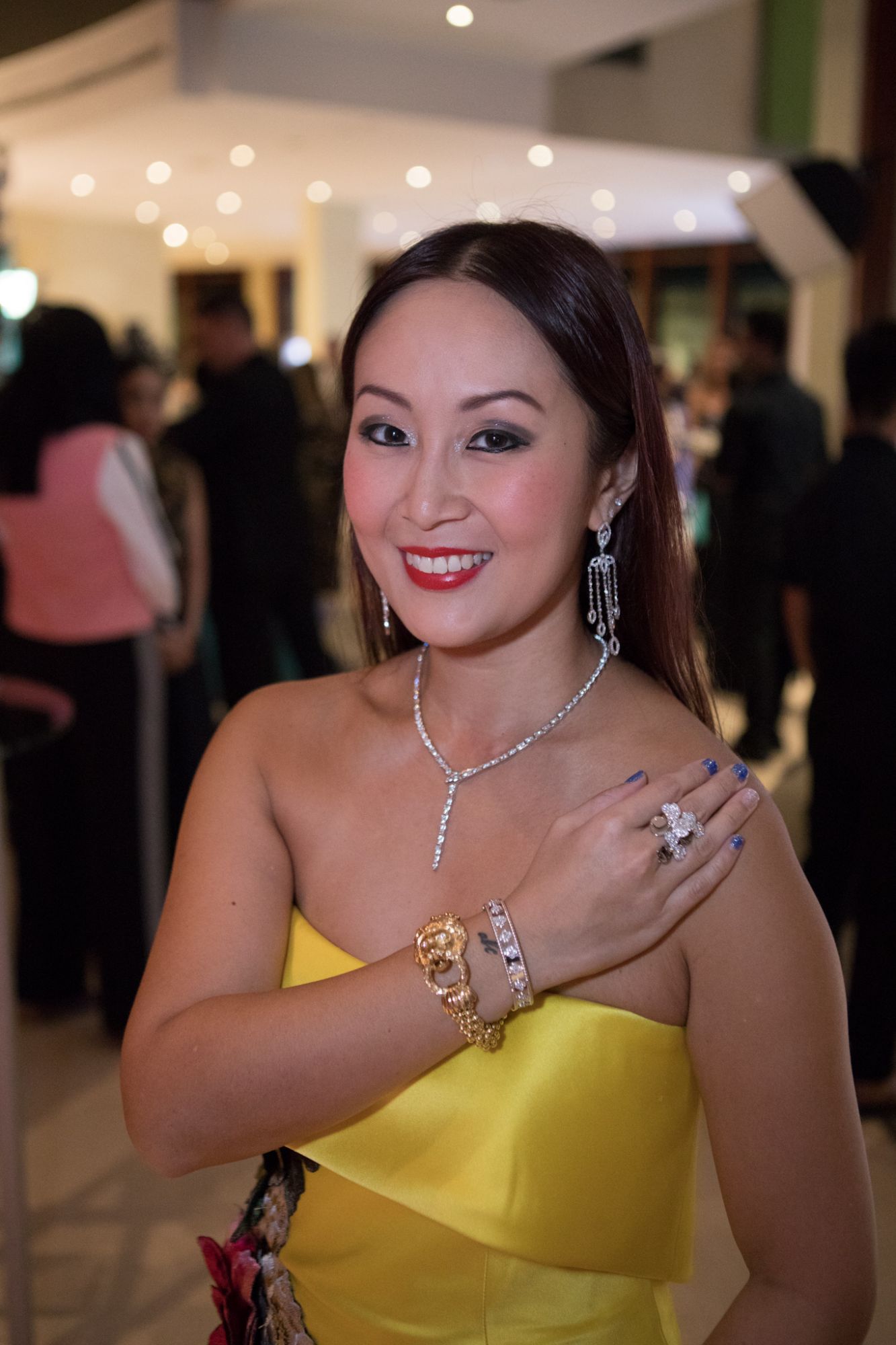 Serene Chua. Ring by Tiffany & Co., gold bracelet (owned by Elizabeth Taylor) and diamond bracelet both by Van Cleef & Arpels, necklace by Bvlgari, earrings by Sara Taseer