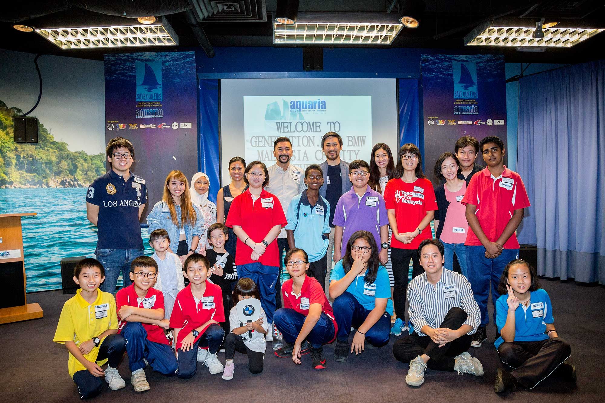 Class photo with the Gen.T honourees, school students and Aquaria's general manager Daryl Foong
