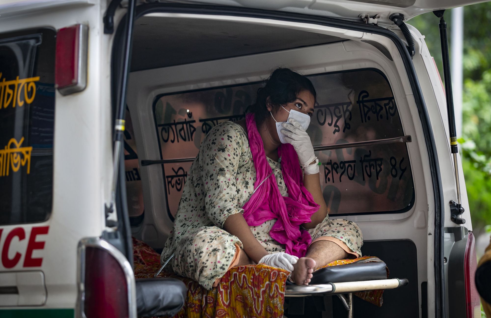 DHAKA, BANGLADESH - JULY 4: 22 year old Toslima, who is pregnant and has tested positive for Covid, arrives at Mugda hospital during a countrywide lockdown to try to contain the spread of Covid-19 on July 4, 2021 in Dhaka, Bangladesh. Bangladesh enacted a 7 day lockdown on July 1st in an effort to contain a third wave of COVID-19, as cases have surged, fueled by the the Delta variant first detected in neighboring India. (Photo by Allison Joyce/Getty Images)