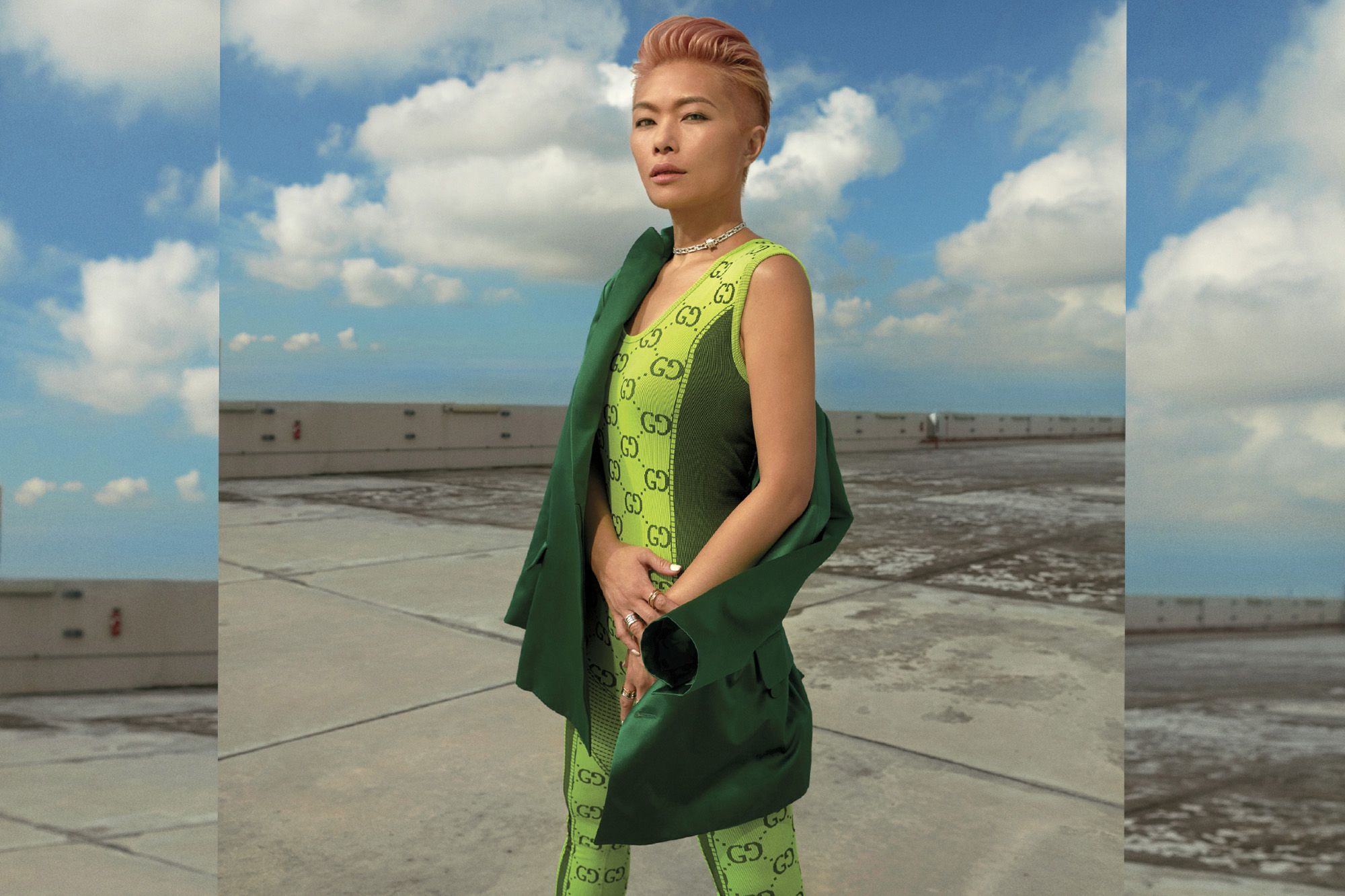 Ng wears a Gucci jacket, jumpsuit, Bulgari B.zero1 pendant necklace, B.zero1 Rock ring, B.zero1 20th Anniversary ring, B.zero1 Labyrinth ring
